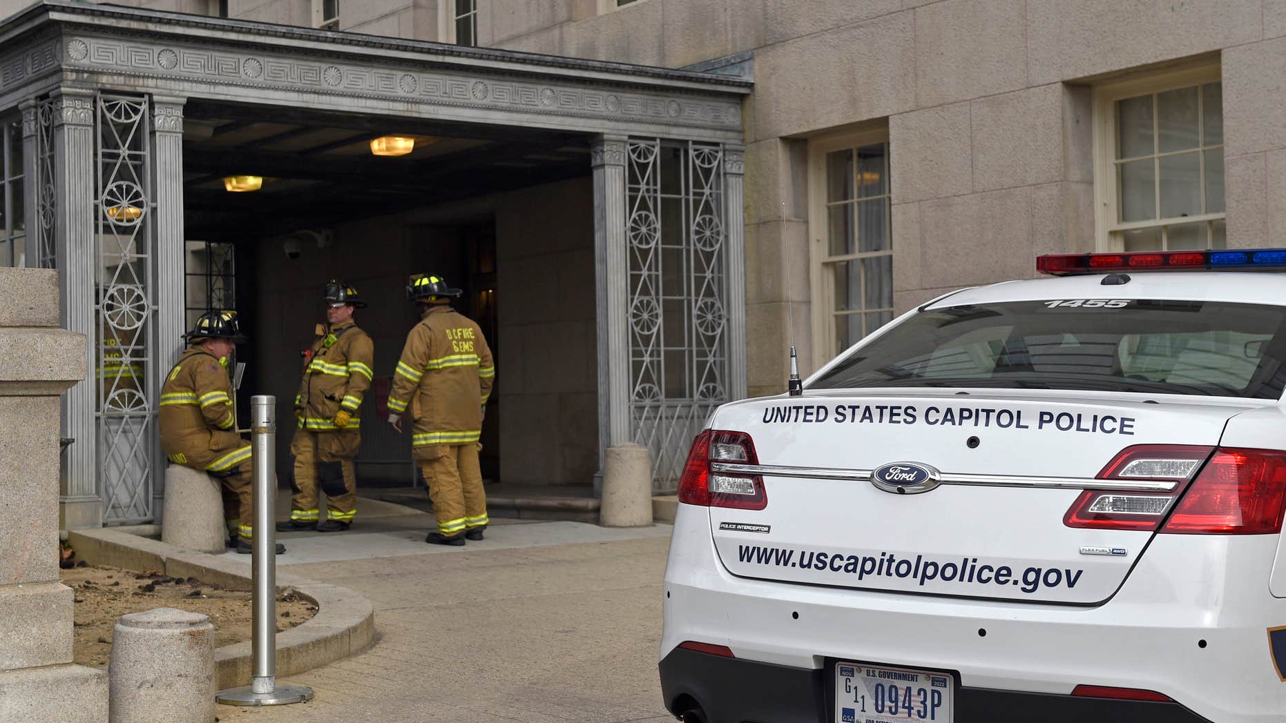 Jan. 15, 2016: Firefighters stand outside the Longworth House Office Building on Capitol Hill in Washington.