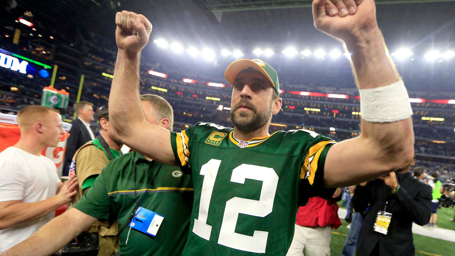 Green Bay Packers quarterback Aaron Rodgers (12) celebrates after winning an NFL divisional playoff football game against the Dallas Cowboys Sunday, Jan. 15, 2017, in Arlington, Texas.