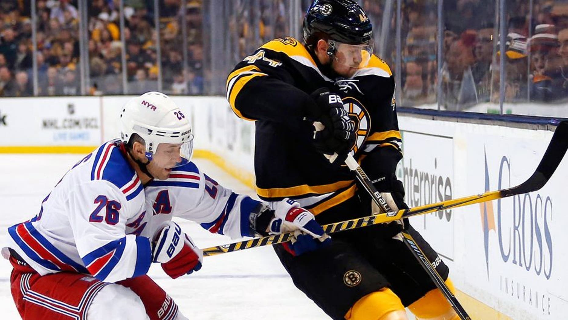 Jan 15, 2015; Boston, MA, USA; New York Rangers right wing Martin St. Louis (26) battles for the puck with Boston Bruins defenseman Dennis Seidenberg (44) during the second period at TD Garden. Mandatory Credit: Winslow Townson-USA TODAY Sports