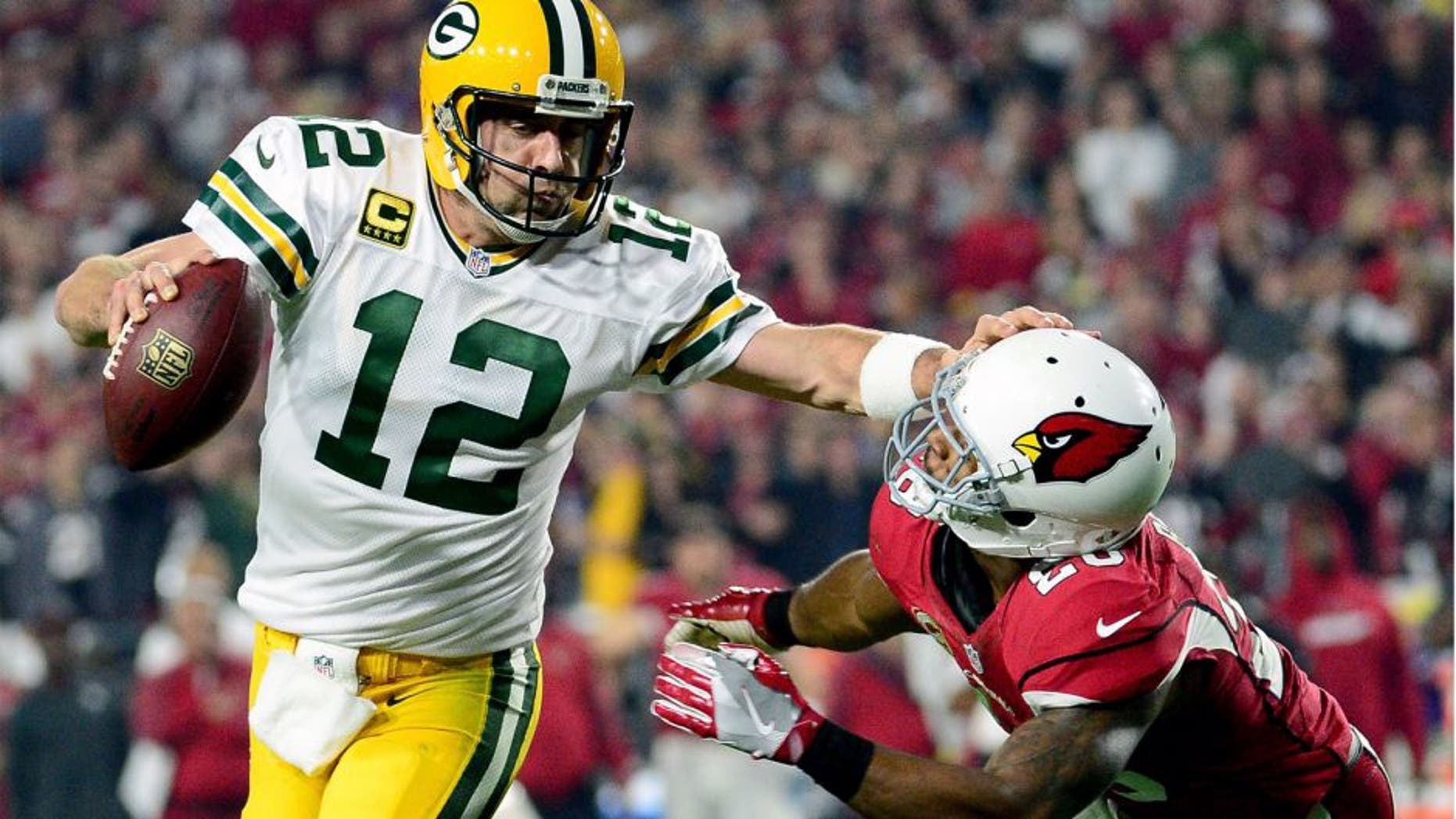 GLENDALE, AZ - JANUARY 16: Running back David Johnson #31 of the Arizona Cardinals is hit by inside linebacker Jake Ryan #47 of the Green Bay Packers during the first quarter of the NFC Divisional Playoff Game at University of Phoenix Stadium on January 16, 2016 in Glendale, Arizona. (Photo by Harry How/Getty Images)