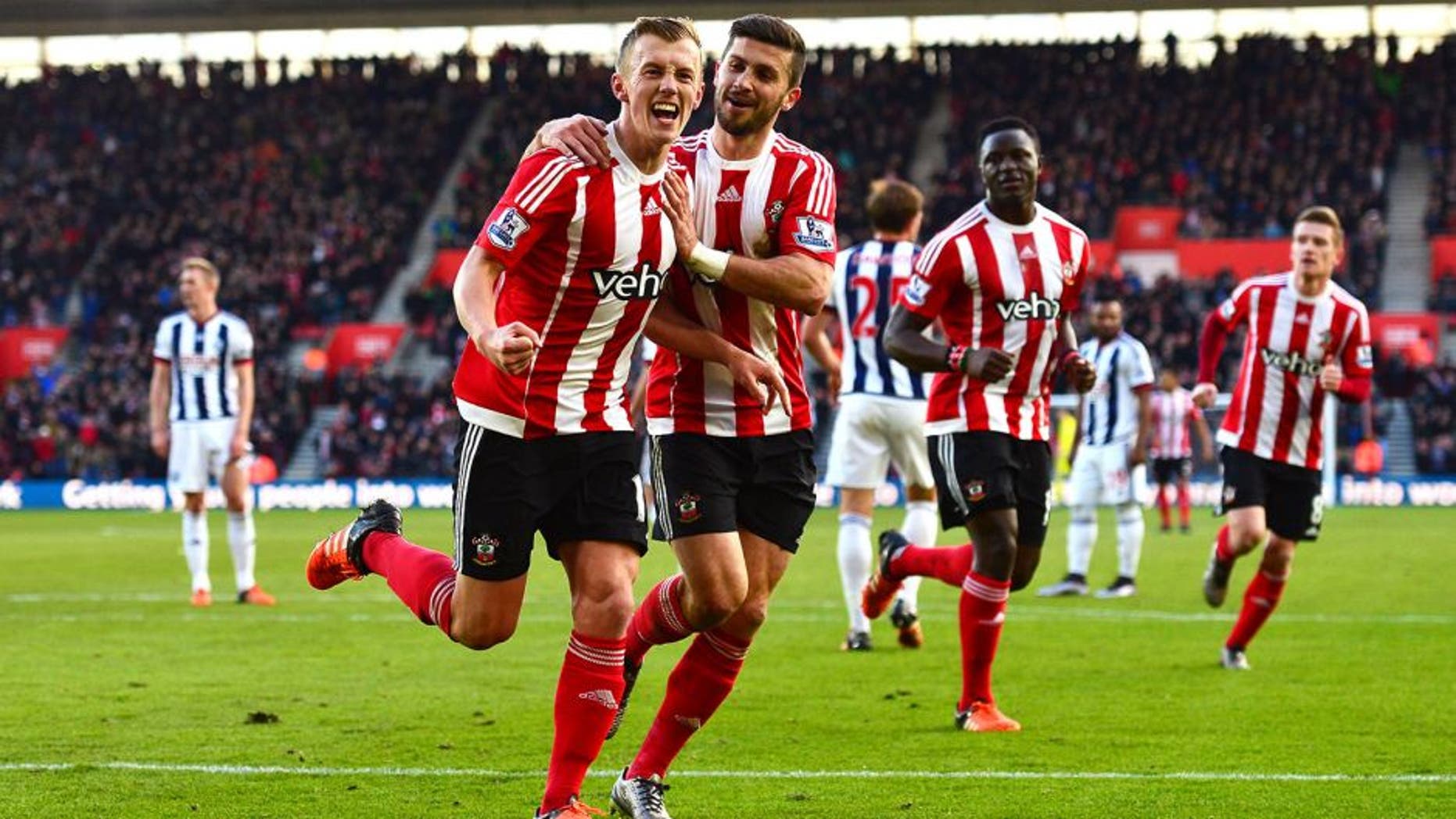 SOUTHAMPTON, ENGLAND - JANUARY 16: James Ward-Prowse (L) of Southampton celebrates scoring his team's second goal with his team mate Shane Long during the Barclays Premier League match between Southampton and West Bromwich Albion at St. Mary's Stadium on January 16, 2016 in Southampton, England. (Photo by Dan Mullan/Getty Images)