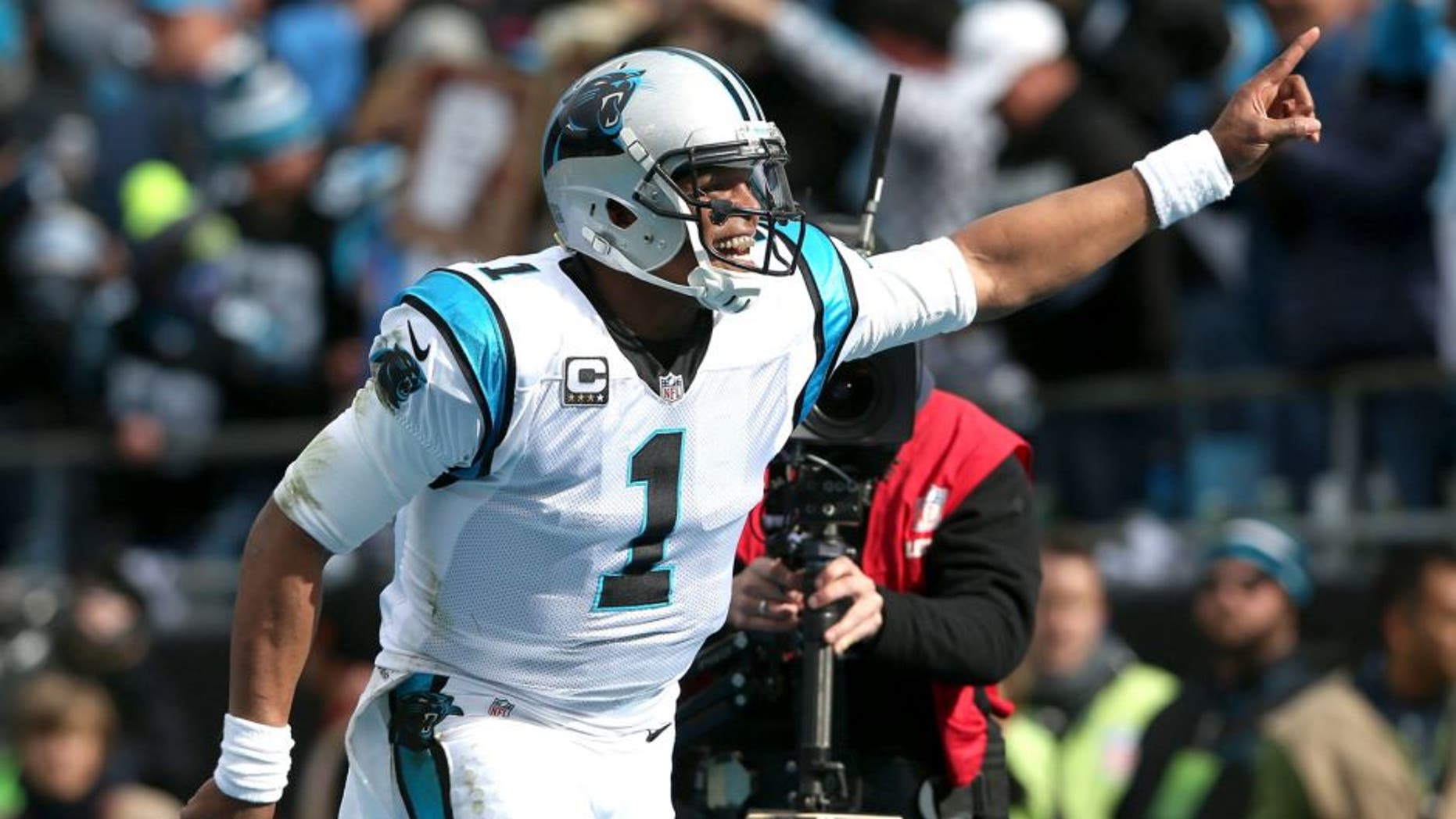 CHARLOTTE, NC - JANUARY 17: Cam Newton #1 of the Carolina Panthers celebrates after a touchdown during the NFC Divisional Playoff Game against the Seattle Seahawks at Bank of America Stadium on January 17, 2016 in Charlotte, North Carolina. (Photo by Streeter Lecka/Getty Images)