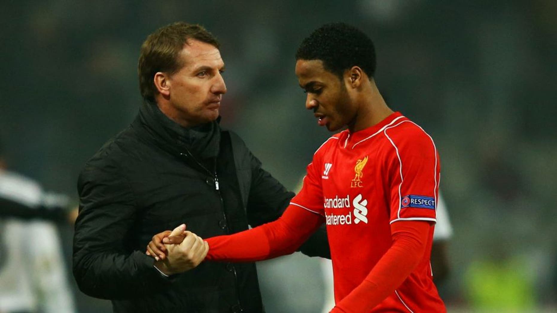 ISTANBUL, TURKEY - FEBRUARY 26: Brendan Rodgers manager of Liverpool shakes hands with Raheem Sterling of Liverpool after defeat in a penalty shoot out during the UEFA Europa League Round of 32 second leg match between Besiktas JK and Liverpool FC on February 26, 2015 in Istanbul, Turkey. (Photo by Richard Heathcote/Getty Images)