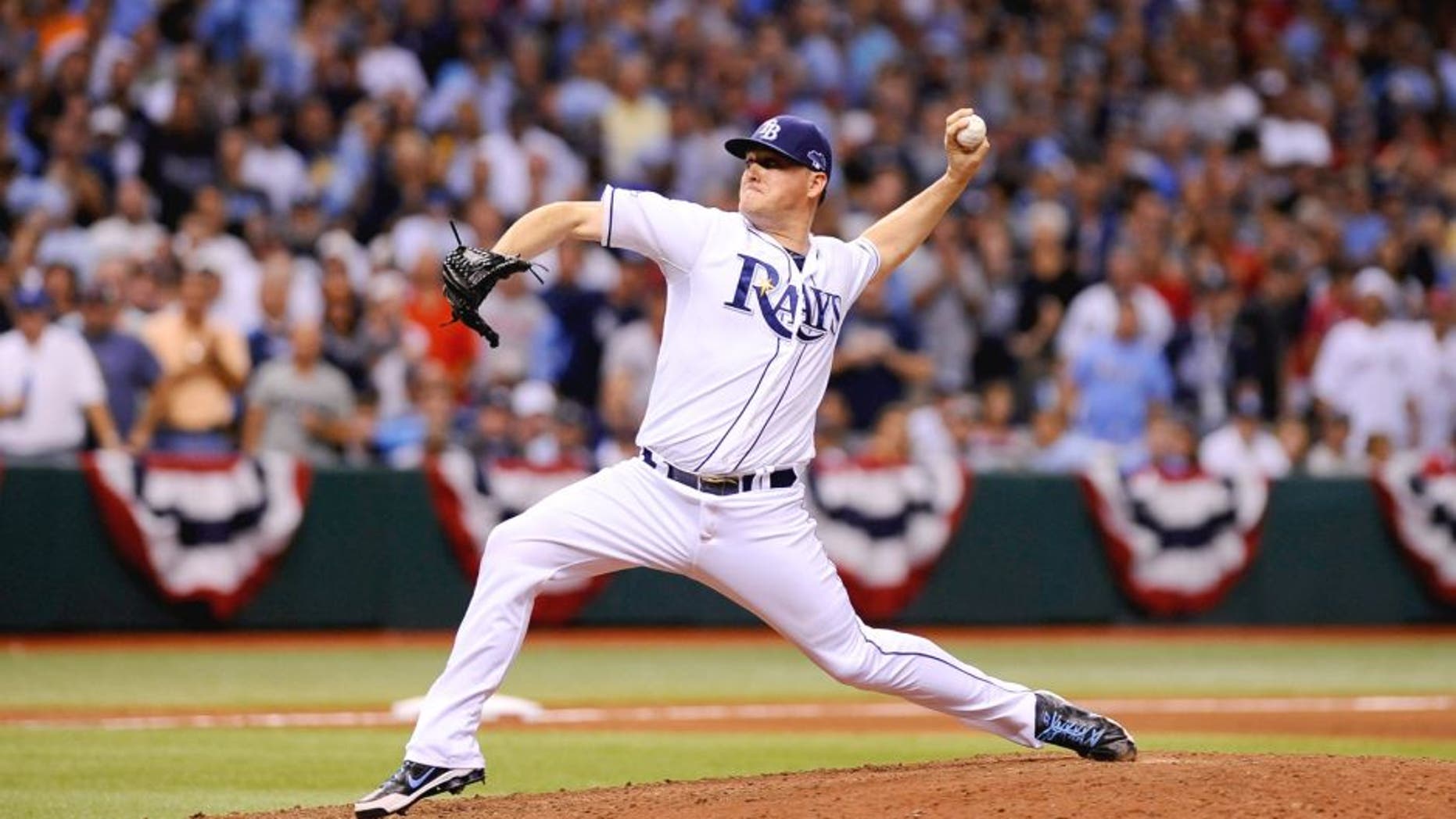ST PETERSBURG, FL - OCTOBER 07: Jake McGee #57 of the Tampa Bay Rays pitches in the eighth inning against the Boston Red Sox during Game Three of the American League Division Series at Tropicana Field on October 7, 2013 in St Petersburg, Florida. (Photo by Brian Blanco/Getty Images)