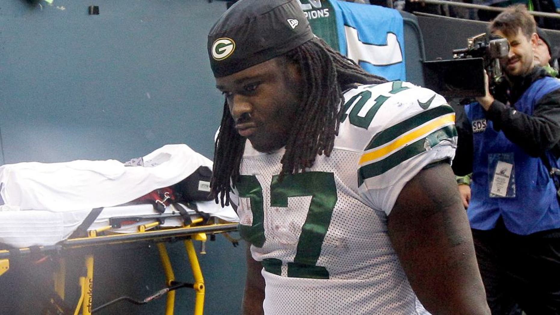 Green Bay Packers' Eddie Lacy looks down as he walks off the field after overtime of the NFL football NFC Championship game against the Seattle Seahawks Sunday, Jan. 18, 2015, in Seattle. The Seahawks won 28-22 to advance to Super Bowl XLIX. (AP Photo/Jeff Chiu)