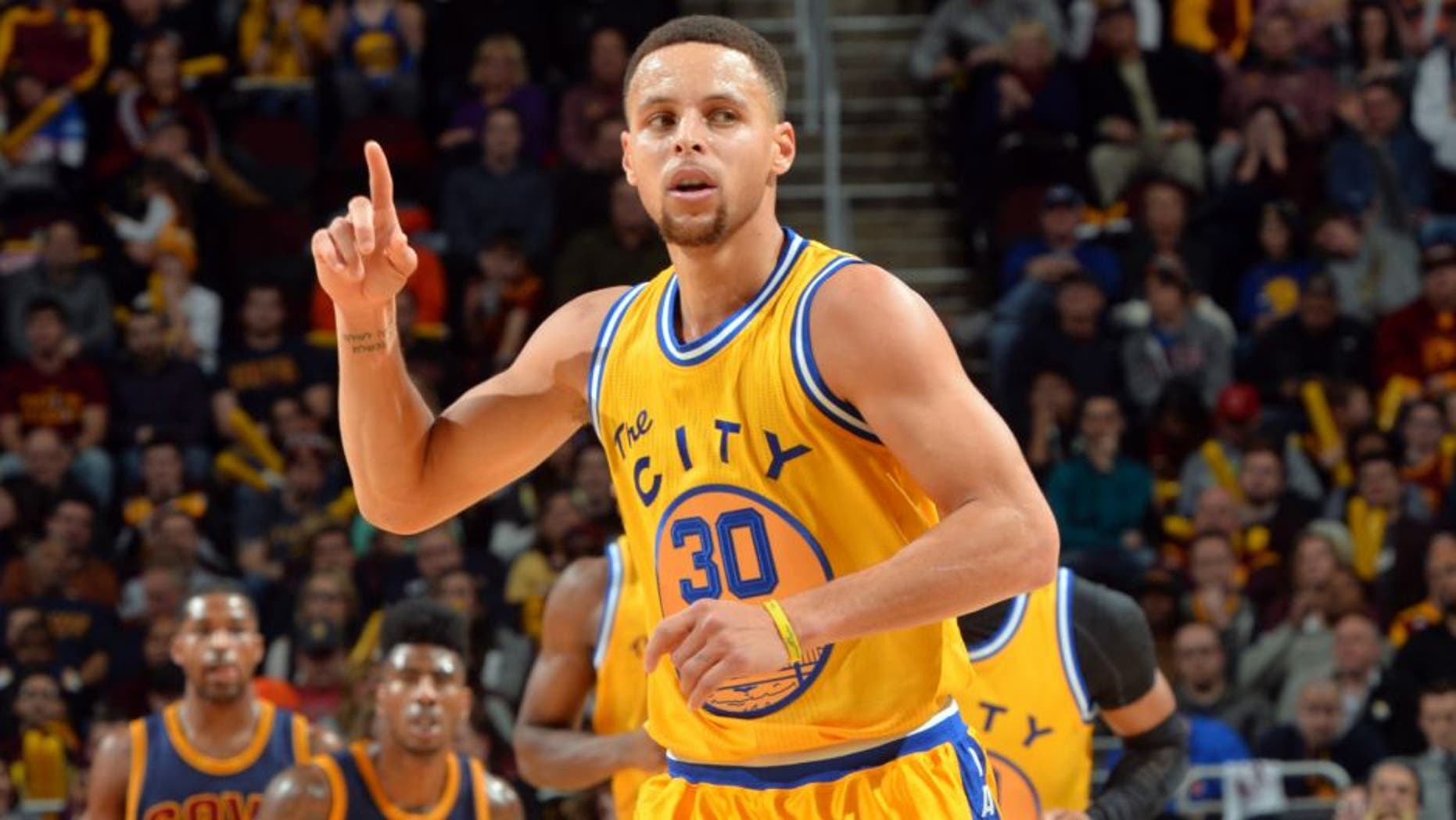 CLEVELAND, OH - JANUARY 18: Stephen Curry #30 of the Golden State Warriors raises his hand during a break in the action against the Cleveland Cavaliers on January 18, 2016 at Quicken Loans Arena in Cleveland, Ohio. (Jesse D. Garrabrant/NBAE via Getty Images)
