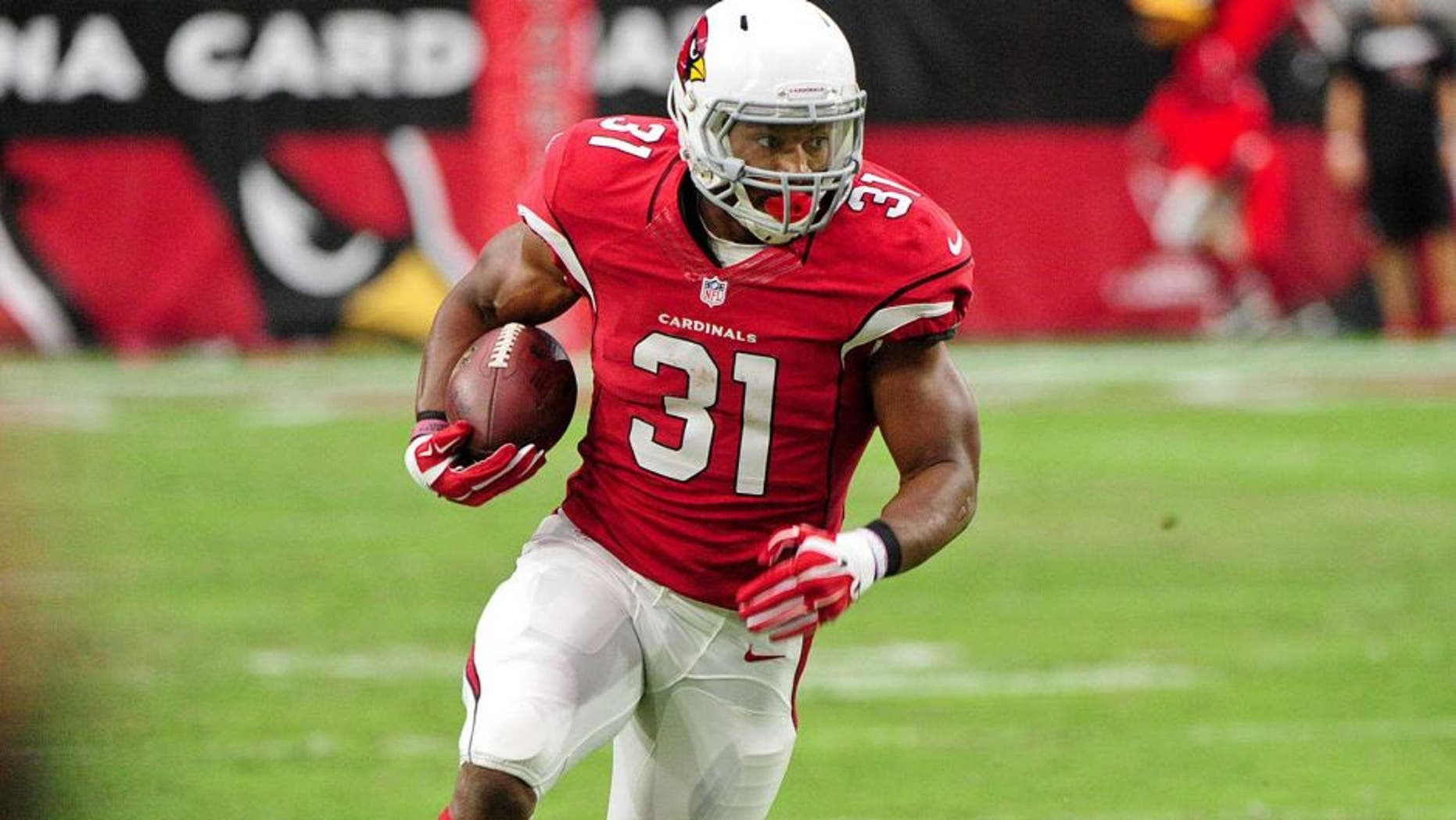 Sep 13, 2015; Glendale, AZ, USA; Arizona Cardinals running back David Johnson (31) carries the ball on a 55 yard touchdown run in the second half against the New Orleans Saints at University of Phoenix Stadium. Mandatory Credit: Matt Kartozian-USA TODAY Sports