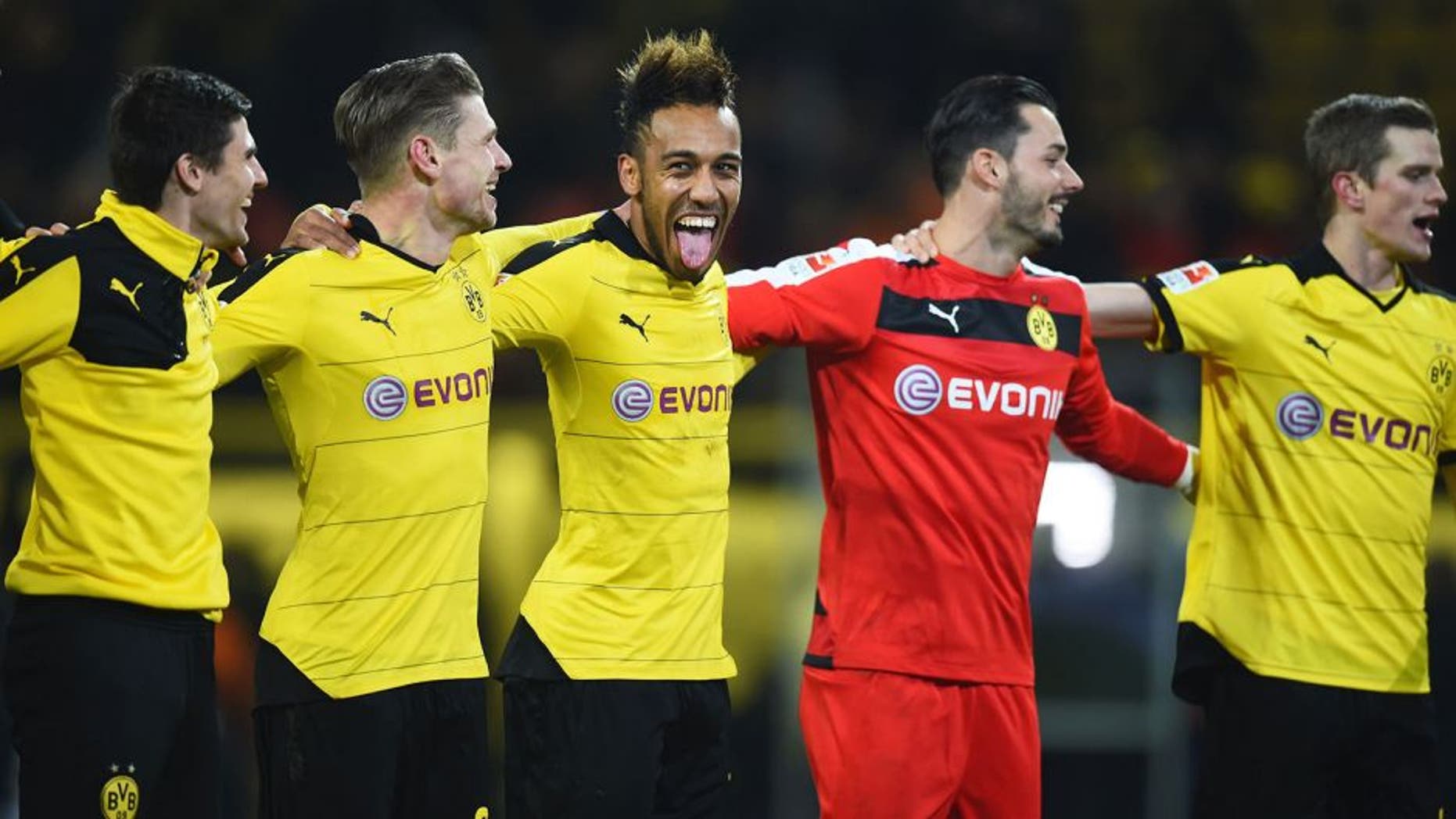 DORTMUND, GERMANY - DECEMBER 13: Pierre-Emerick Aubameyang of Borussia Dortmund (C) celebrates victory with team mates after the Bundesliga match between Borussia Dortmund and Eintracht Frankfurt at Signal Iduna Park on December 13, 2015 in Dortmund, Germany. (Photo by Lars Baron/Bongarts/Getty Images)