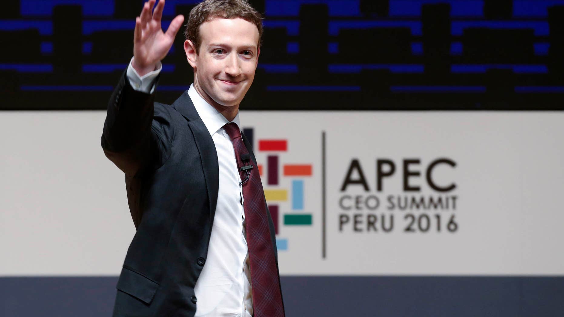 FILE - In this Saturday, Nov. 19, 2016 file photo, Mark Zuckerberg, chairman and CEO of Facebook, waves at the CEO summit during the annual Asia Pacific Economic Cooperation (APEC) forum in Lima, Peru.