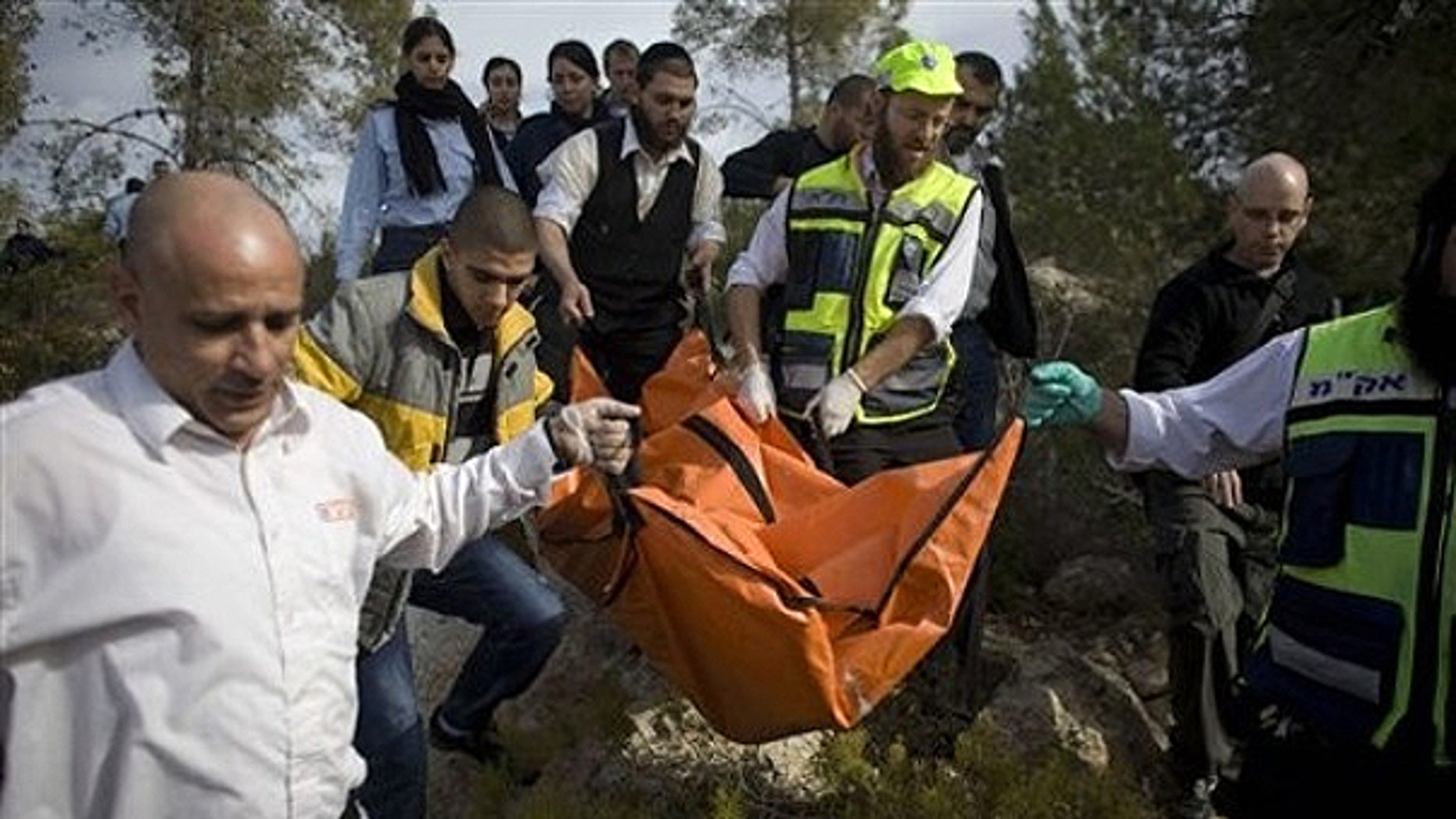 Dec. 19, 2010: Israeli rescue workers carry the body of U.S. tourist Kristine Luken after she was found in a wooded area near the village of Mata, outside Jerusalem.