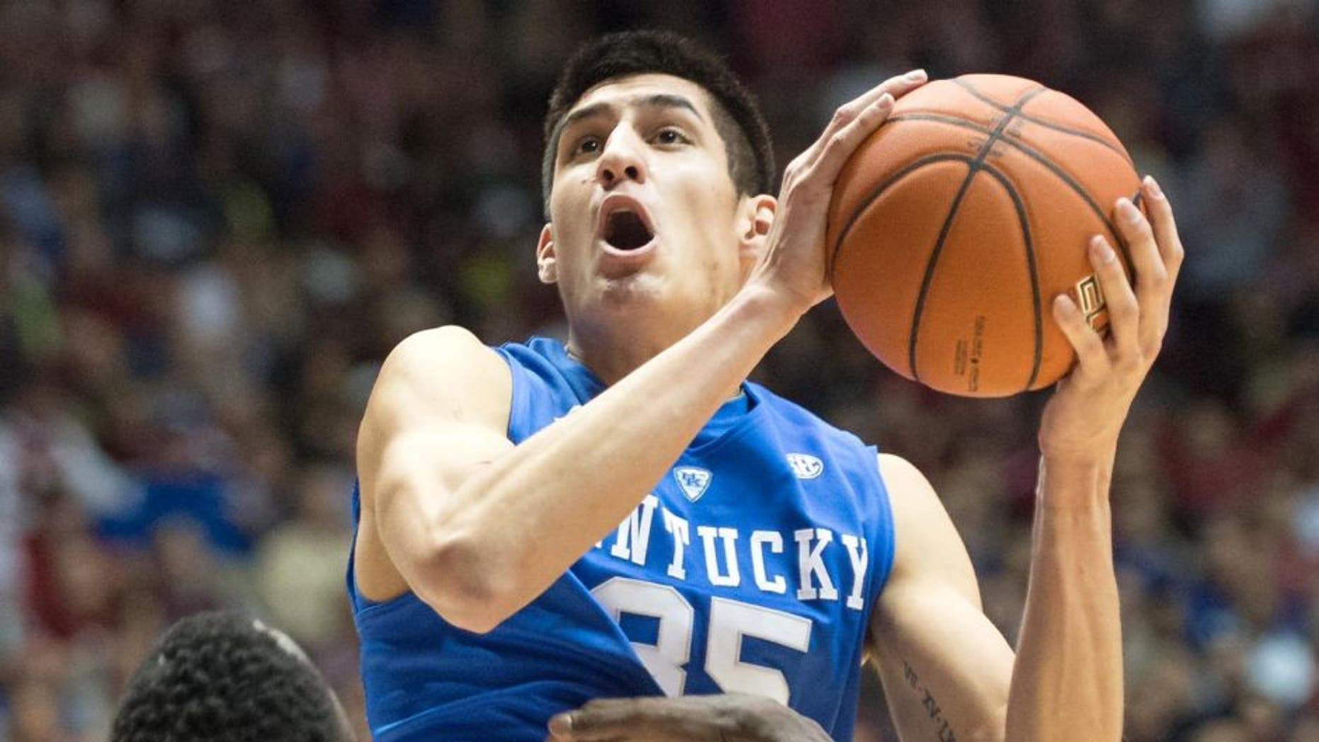 TUSCALOOSA, AL - JANUARY 17: Derek Willis #35 of the Kentucky Wildcats attempts a layup over Rodney Cooper #21 of the Alabama Crimson Tide during the game at Coleman Coliseum on January 17, 2015 in Tuscaloosa, Alabama. At halftime the Kentucky Wildcats leads the Alabama Crimson Tide 35-17. (Photo by Michael Chang/Getty Images)