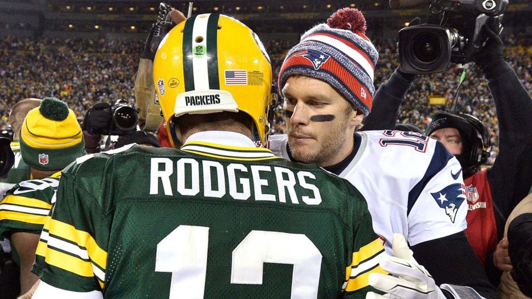 GREEN BAY, WI - NOVEMBER 30: Tom Brady #12 of the New England Patriots (R) congratulates fellow quarterback Aaron Rodgers #12 of the Green Bay Packers after their game at Lambeau Field on November 30, 2014 in Green Bay, Wisconsin. The Packers defeated the Patriots 26-21. (Photo by Brian D. Kersey/Getty Images)