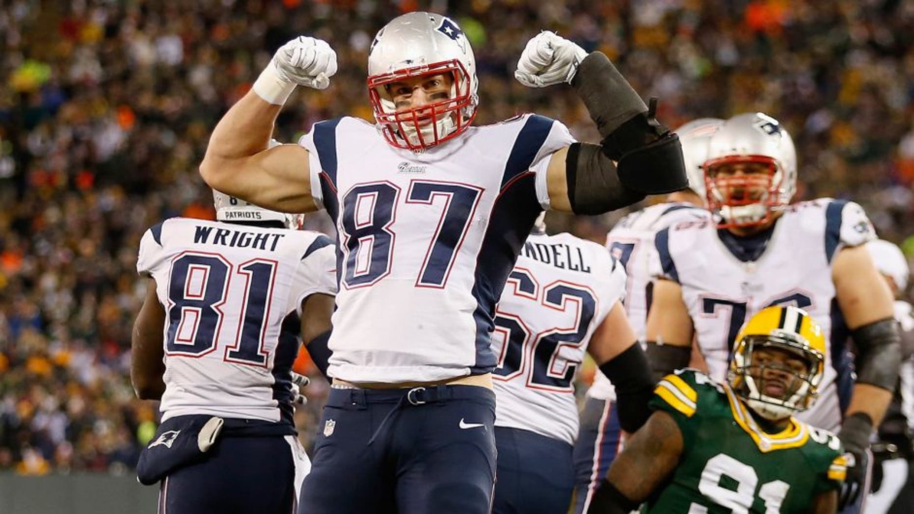 GREEN BAY, WI - NOVEMBER 30: Tight end Rob Gronkowski #87 of the New England Patriots celebrates after a first down reception against the Green Bay Packers during the second quarter of the NFL game at Lambeau Field on November 30, 2014 in Green Bay, Wisconsin. (Photo by Christian Petersen/Getty Images)