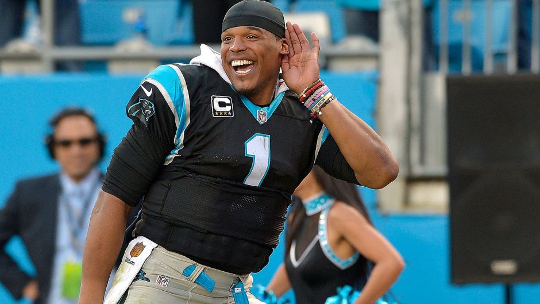 CHARLOTTE, NC - DECEMBER 13: Cam Newton #1 of the Carolina Panthers listens to the fans cheer during the final seconds of a win against the Atlanta Falcons at Bank of America Stadium on December 13, 2015 in Charlotte, North Carolina. The Panthers won 38-0. (Photo by Grant Halverson/Getty Images)