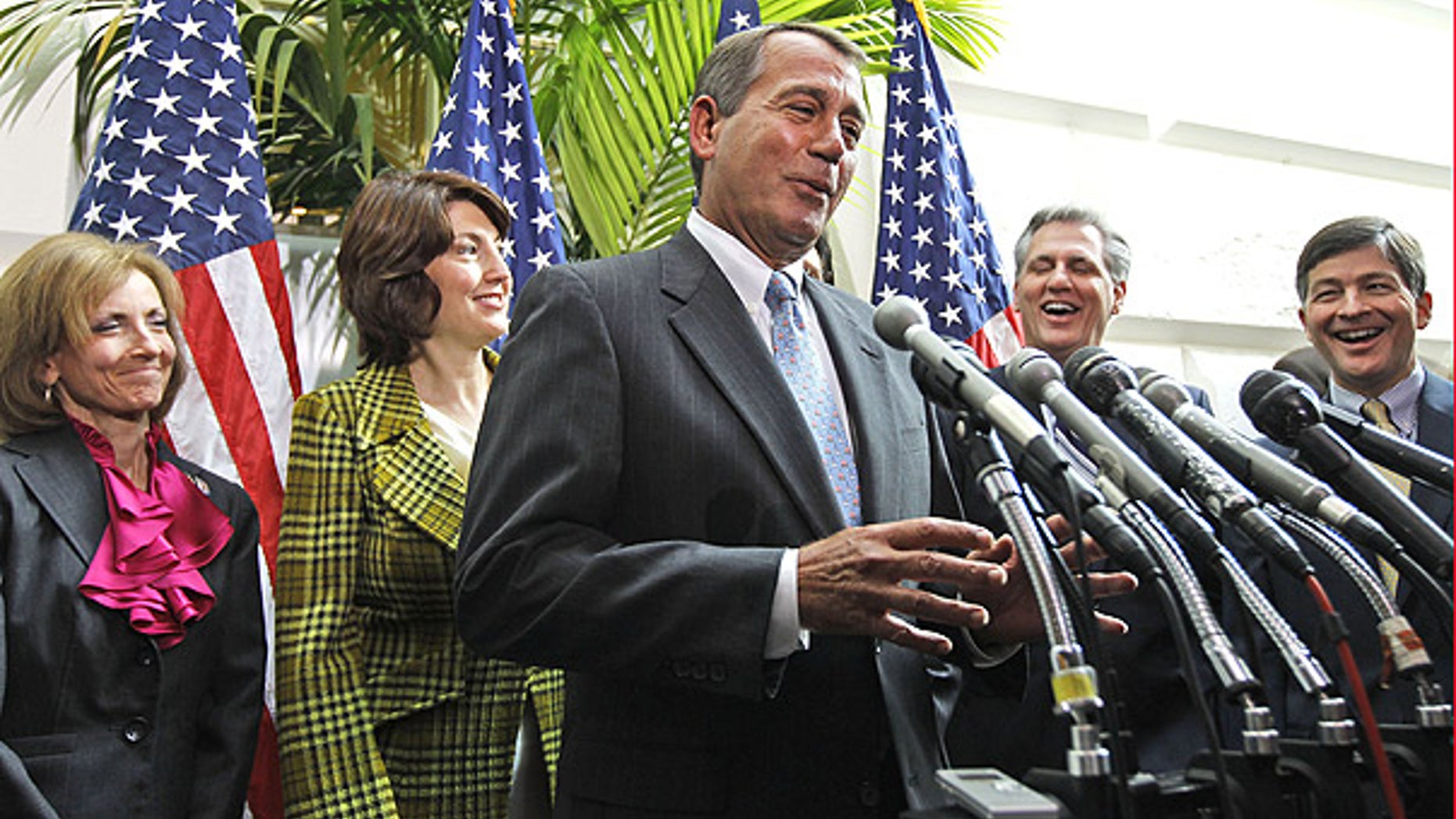 FILE: In this Jan. 19, 2011, photo, House Speaker John Boehner, flanked by GOP representatives, speaks about the health care law repeal vote.