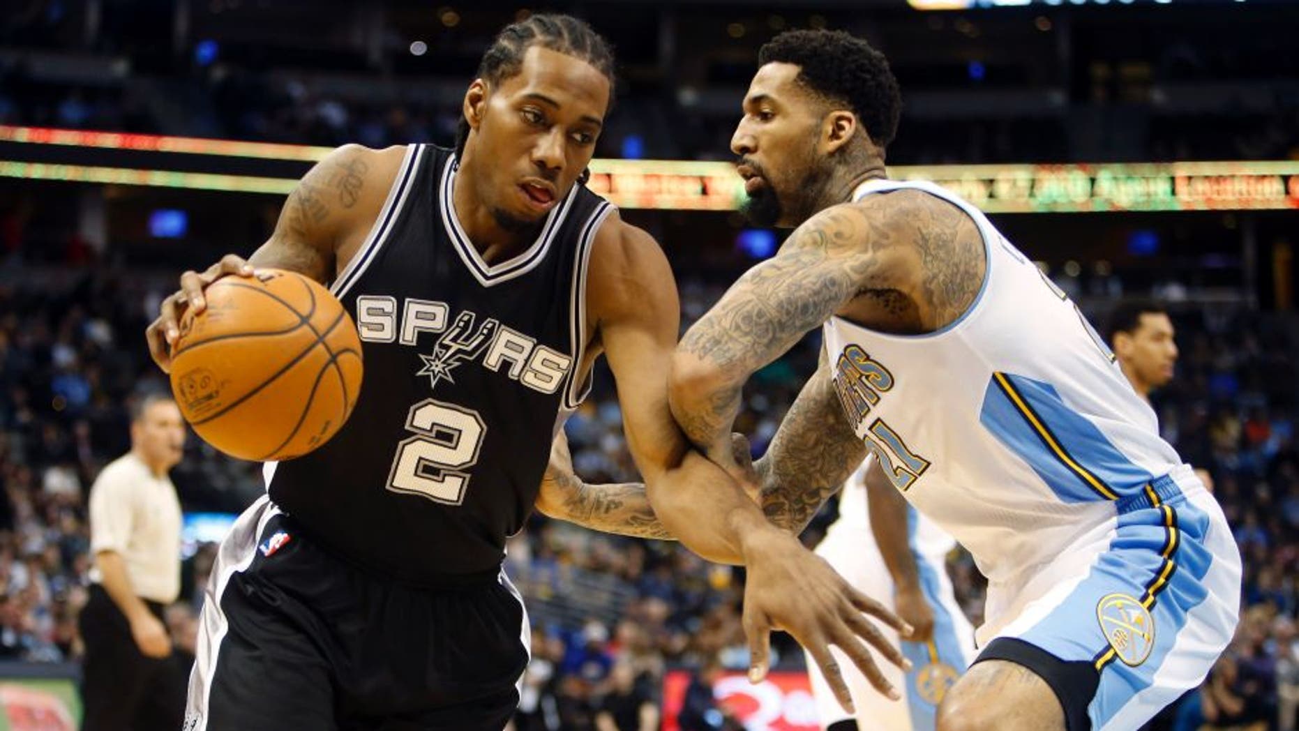 Jan 20, 2015; Denver, CO, USA; San Antonio Spurs forward Kawhi Leonard (2) drives to the basket against Denver Nuggets forward Wilson Chandler (21) during the first half at Pepsi Center. Mandatory Credit: Chris Humphreys-USA TODAY Sports