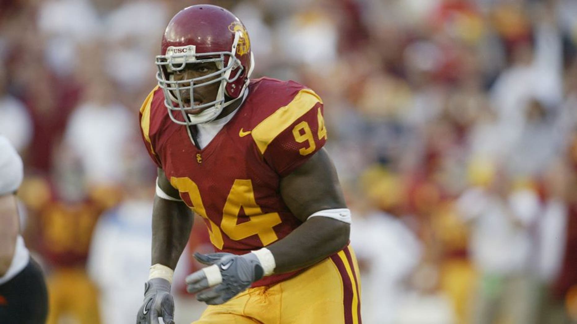 LOS ANGELES - SEPTEMBER 28: Defensive end Kenechi Udeze #94 of the USC Trojans runs on the field during the Pacific 10 Conference football game against the Oregon State Beavers on September 28, 2002 at the Los Angeles Coliseum in Los Angeles, California. The Trojans shut out the Beavers 22-0. (Photo by Stephen Dunn/Getty Images)
