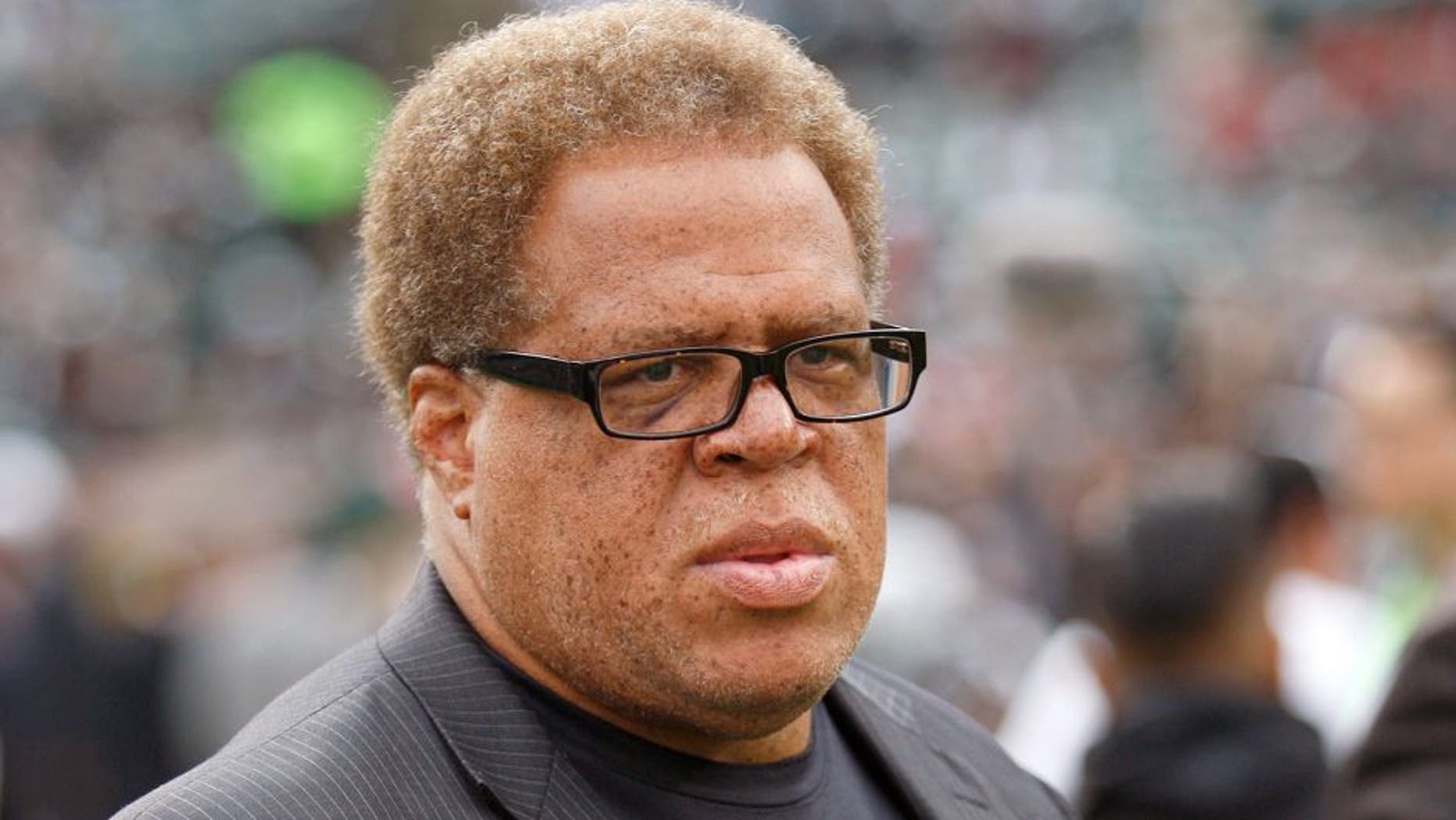 OAKLAND, CA - DECEMBER 7: General Manager Reggie McKenzie of the Oakland Raiders stands of the field prior to the game against the San Francisco 49ers at O.co Coliseum on December 7, 2014 in Oakland, California. The Raiders defeated the 49ers 24-13. (Photo by Michael Zagaris/San Francisco 49ers/Getty Images)