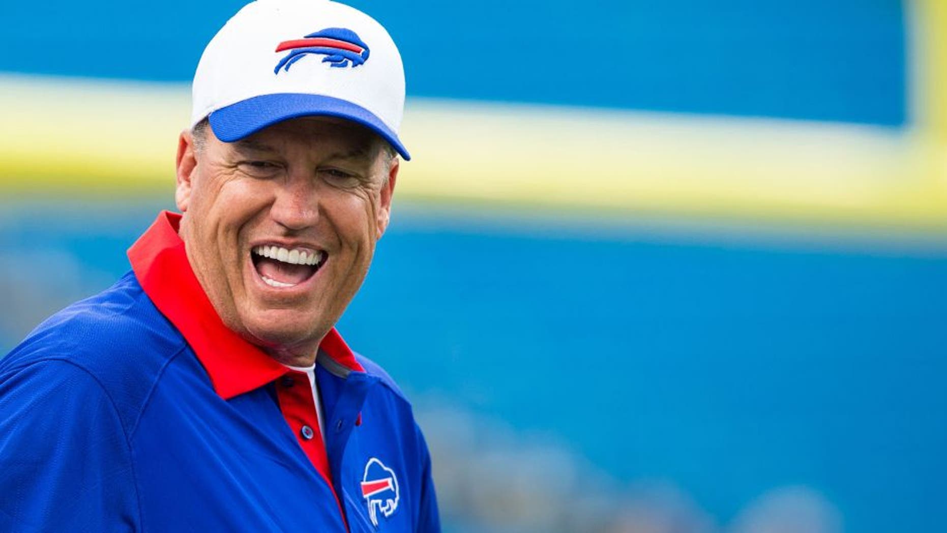 ORCHARD PARK, NY - AUGUST 14: Head coach Rex Ryan of the Buffalo Bills laughs with players before the game against the Carolina Panthers on August 14, 2015 at Ralph Wilson Stadium in Orchard Park, New York. (Photo by Brett Carlsen/Getty Images)