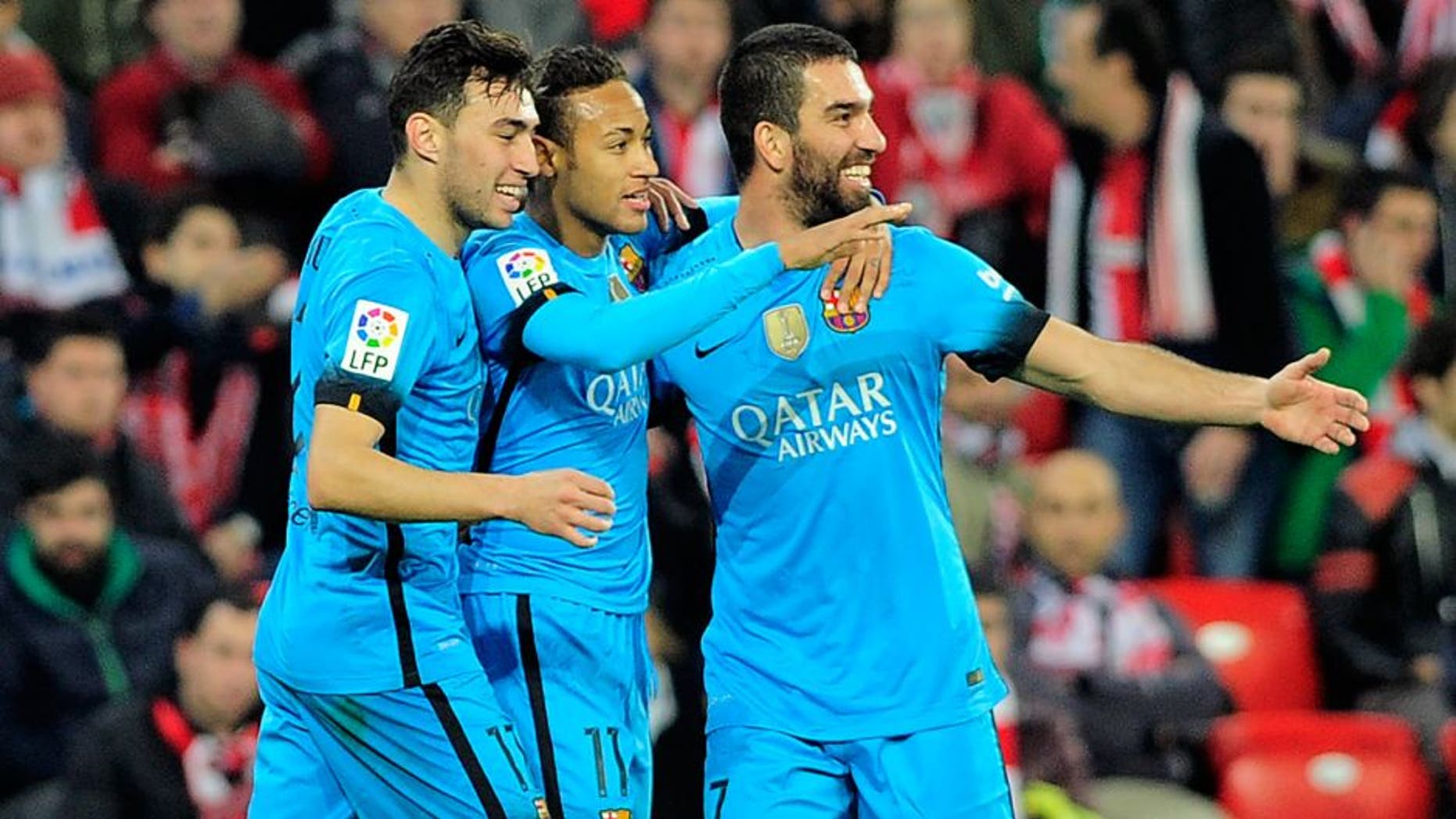Barcelona's Brazilian forward Neymar da Silva Santos Junior (C) celebrates a goal with forward Munir El Haddadi (L) and Turkish midfielder Arda Turan during the Spanish Copa del Rey (King's Cup) football match Athletic Club de Bilbao vs FC Barcelona at the San Mames stadium in Bilbao on January 20, 2016. AFP PHOTO / ANDER GILLENEA / AFP / ANDER GILLENEA (Photo credit should read ANDER GILLENEA/AFP/Getty Images)