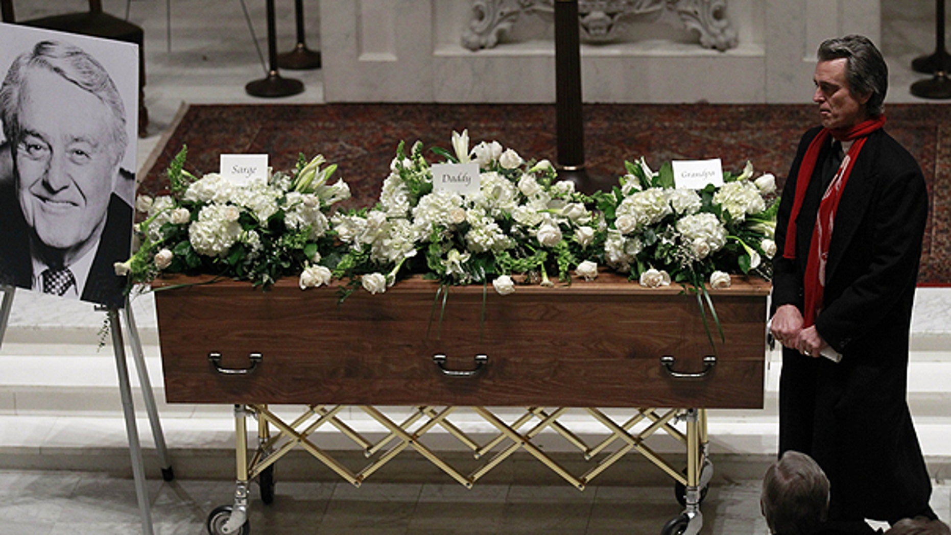 Jan. 21: Bobby Shriver walks past the casket during the wake for his father R. Sargent Shriver at Holy Trinity Catholic Church in Washington.
