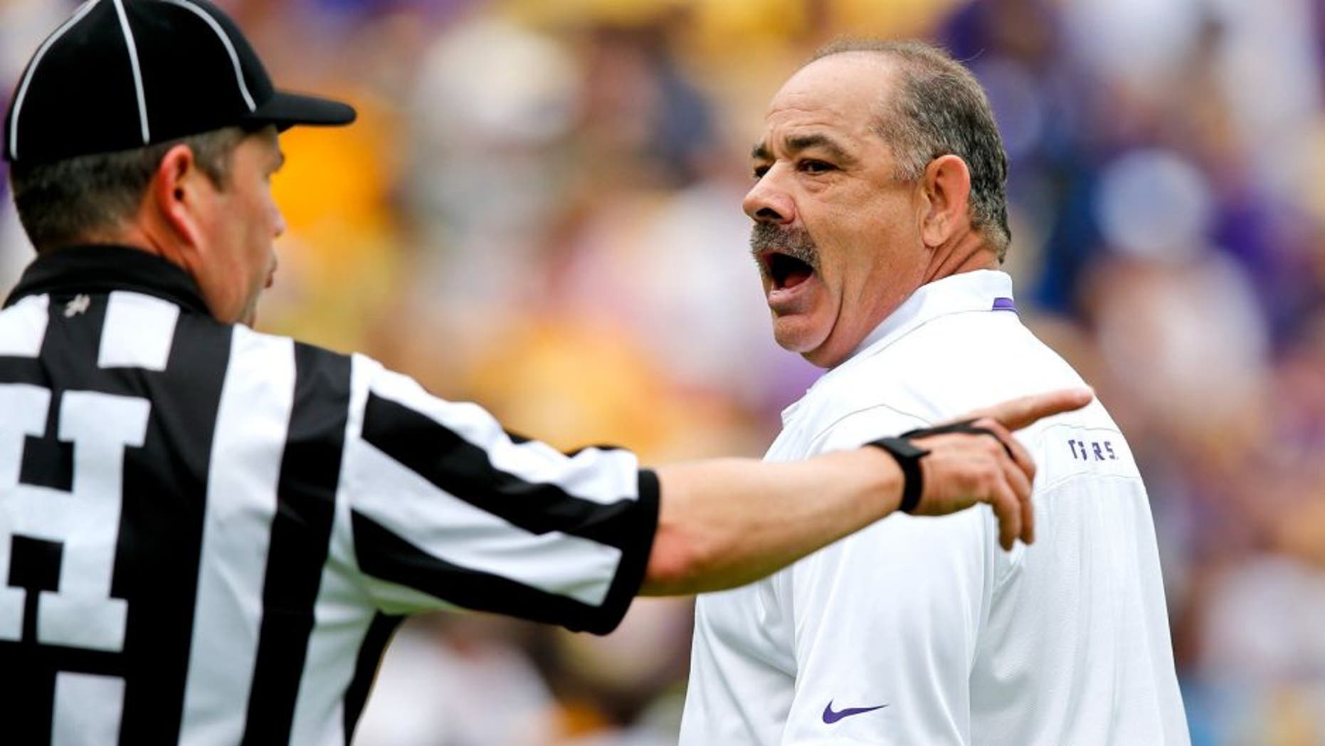Apr 5, 2014; Baton Rouge, LA, USA; LSU Tigers defensive coordinator John Chavis (R) argues with an official during the 2014 spring game at Tiger Stadium. Mandatory Credit: Derick E. Hingle-USA TODAY Sports