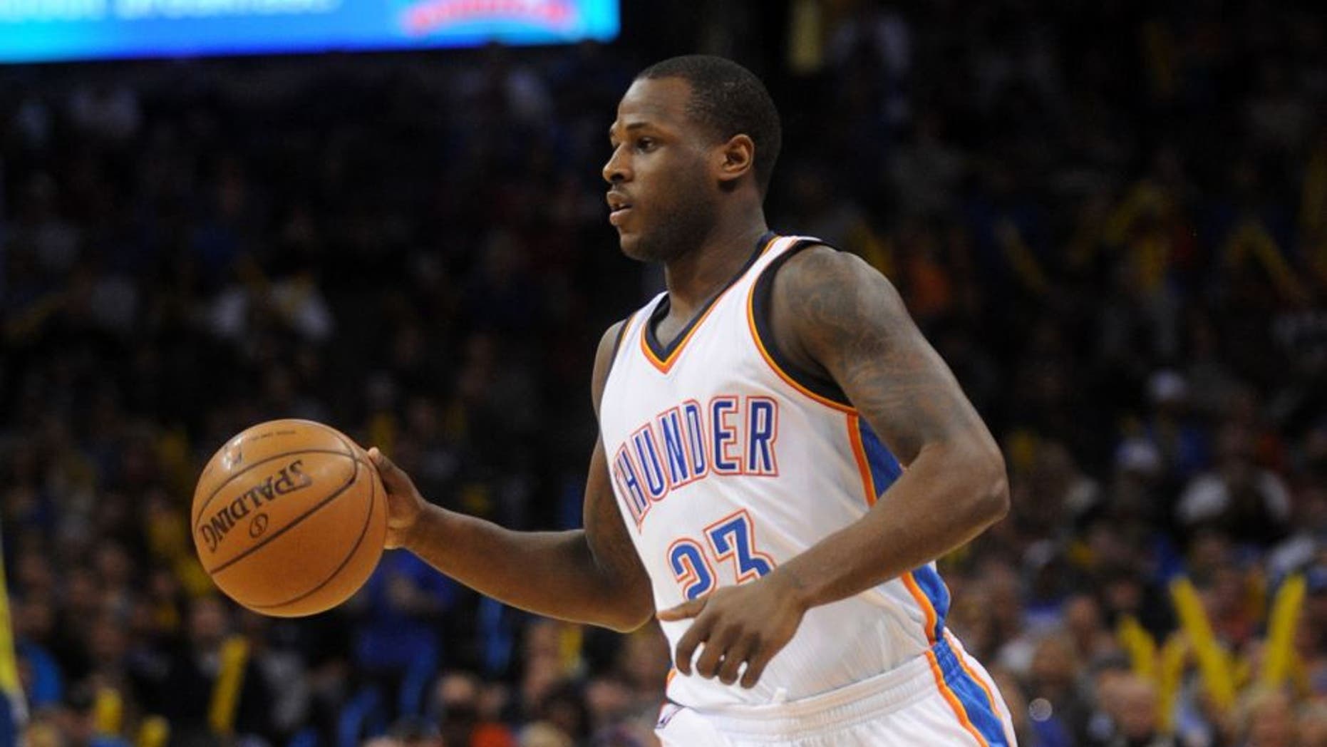 Jan 9, 2015; Oklahoma City, OK, USA; Oklahoma City Thunder guard Dion Waiters (23) handles the ball against the Utah Jazz during the first quarter at Chesapeake Energy Arena. Mandatory Credit: Mark D. Smith-USA TODAY Sports