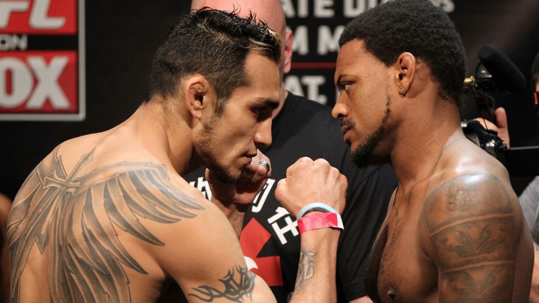 EAST RUTHERFORD, NJ - MAY 04: (L-R) Lightweight opponents Tony Ferguson and Michael Johnson face off after weighing in during the UFC on FOX official weigh in at Izod Center on May 4, 2012 in East Rutherford, New Jersey. (Photo by Josh Hedges/Zuffa LLC/Zuffa LLC via Getty Images)