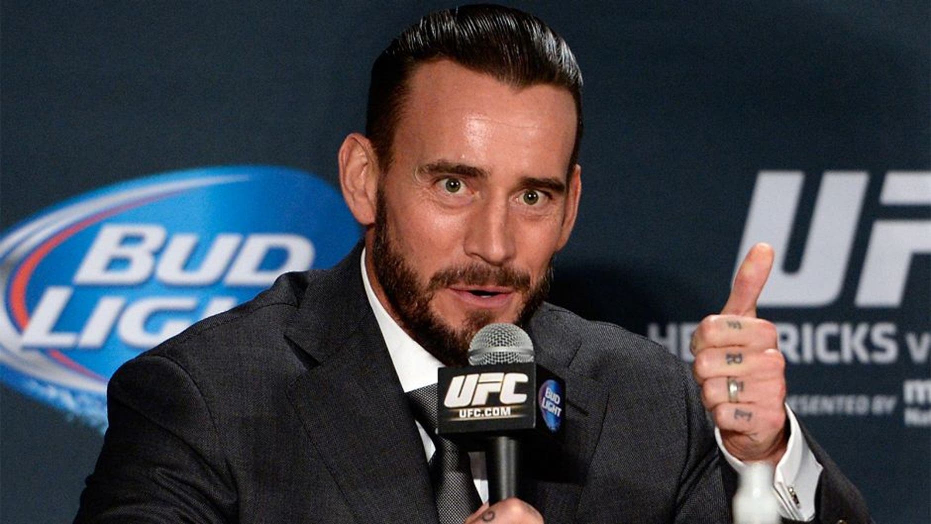 LAS VEGAS, NEVADA - DECEMBER 6: Phil 'CM Punk' Brooks speaks to the media during the UFC 181 post fight press conference inside the Mandalay Bay Events Center on December 6, 2014 in Las Vegas, Nevada. (Photo by Jeff Bottari/Zuffa LLC/Zuffa LLC via Getty Images)