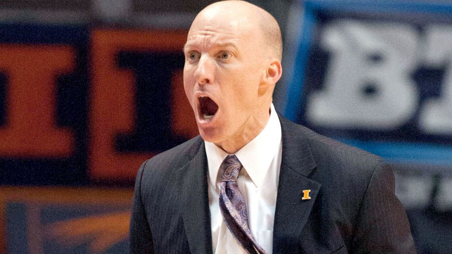 Jan 18, 2014; Champaign, IL, USA; Illinois Fighting Illini head coach John Groce yells at the referees during the game against the Michigan State Spartans at State Farm Center. The Michigan State Spartans beat the Illinois Fighting Illini 78-62. Mandatory Credit: Trevor Ruszkowksi-USA TODAY Sports