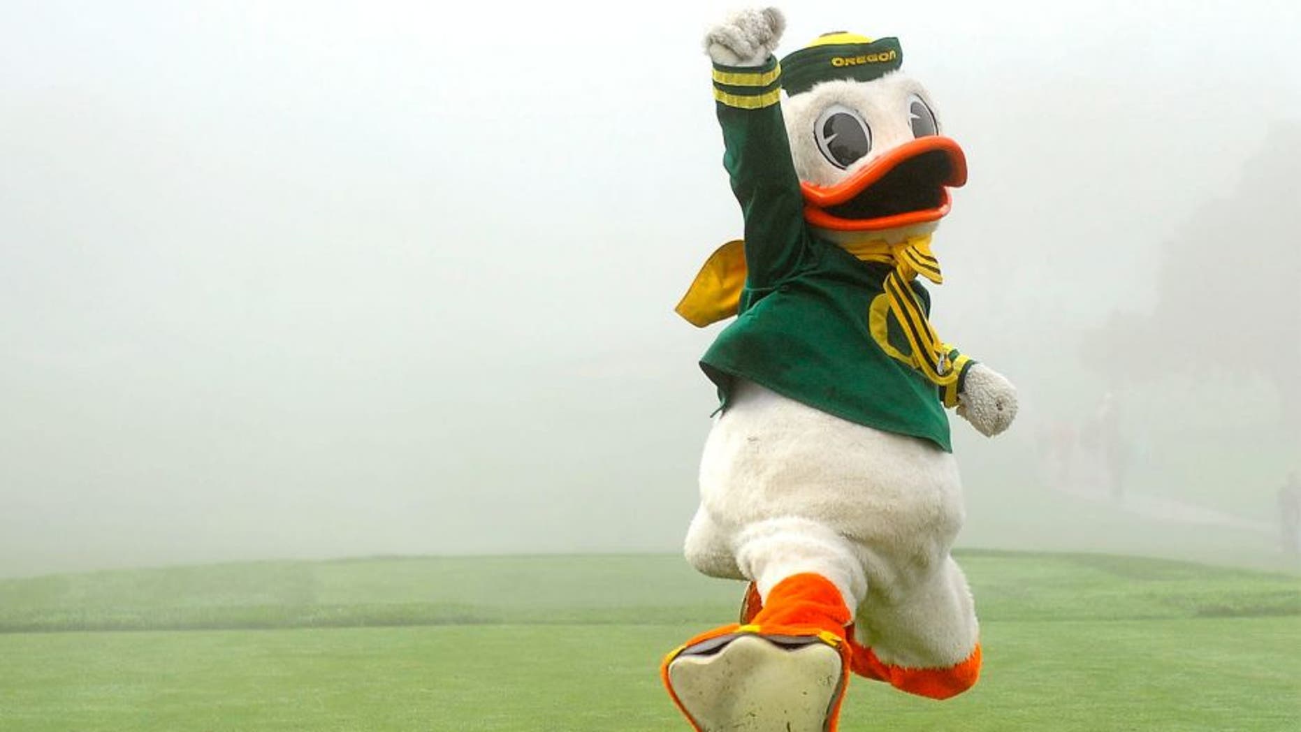 January 26, 2013; La Jolla, CA, USA; The Oregon Ducks mascot celebrates after winning a dance competition during a fog delay before the start of the third round of the Farmers Insurance Open at Torrey Pines. Mandatory Credit: Photo By Christopher Hanewinckel-USA TODAY Sports