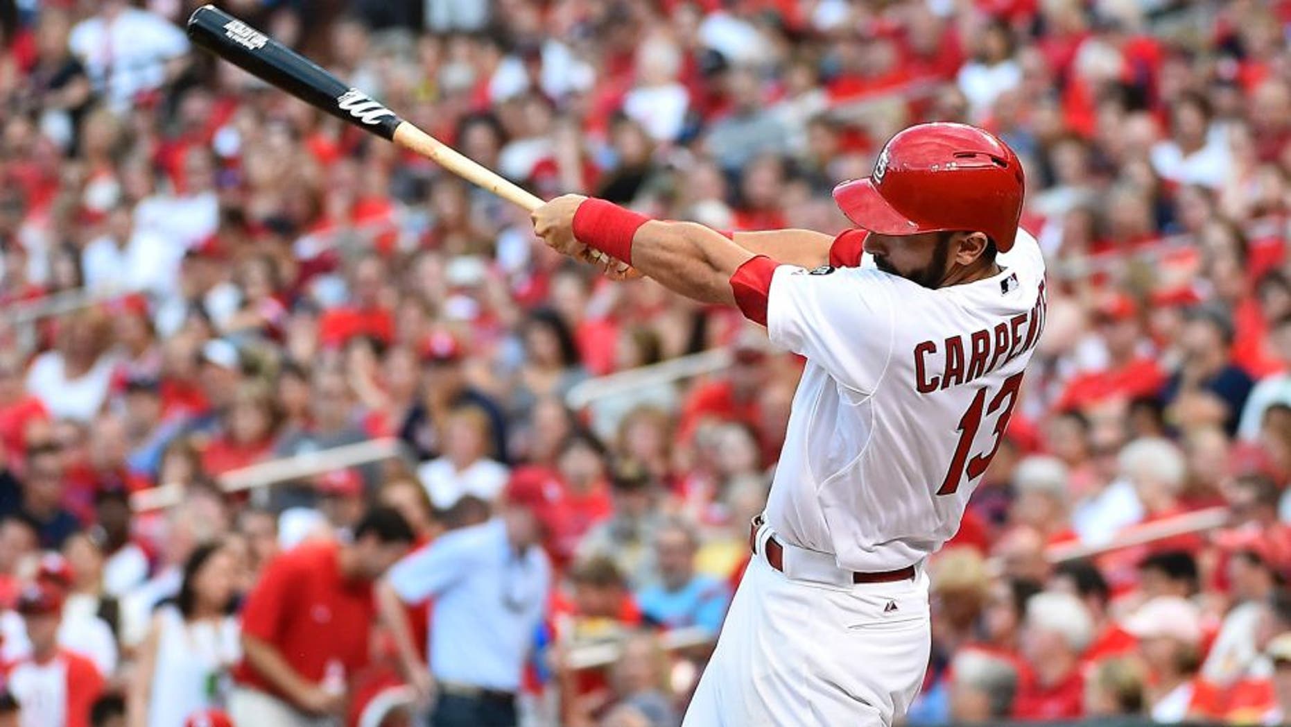 Jul 30, 2015; St. Louis, MO, USA; St. Louis Cardinals third baseman Matt Carpenter (13) connects for a three-run home run off of Colorado Rockies starting pitcher Chris Rusin (not pictured) in the second inning at Busch Stadium. Mandatory Credit: Jasen Vinlove-USA TODAY Sports