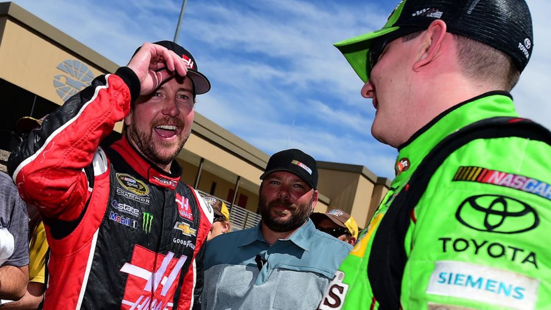 SONOMA, CA - JUNE 28: Kurt Busch, driver of the #41 Haas Automation Chevrolet, congratulates Kyle Busch, driver of the #18 M&M's Crispy Toyota, after winning the NASCAR Sprint Cup Series Toyota/Save Mart 350 at Sonoma Raceway on June 28, 2015 in Sonoma, California. (Photo by Jared C. Tilton/Getty Images)