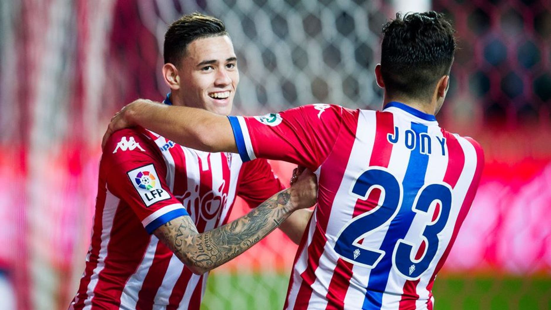 GIJON, SPAIN - JANUARY 22: Arnaldo Sanabria of Real Sporting de Gijon celebrates with his teammates Jony Rodriguez of Real Sporting de Gijon after scoring his team's fourth goal during the La Liga match between Real Sporting de Gijon and Real Sociedad de Futbol at Estadio El Molinon on January 22, 2016 in Gijon, Spain. (Photo by Juan Manuel Serrano Arce/Getty Images)