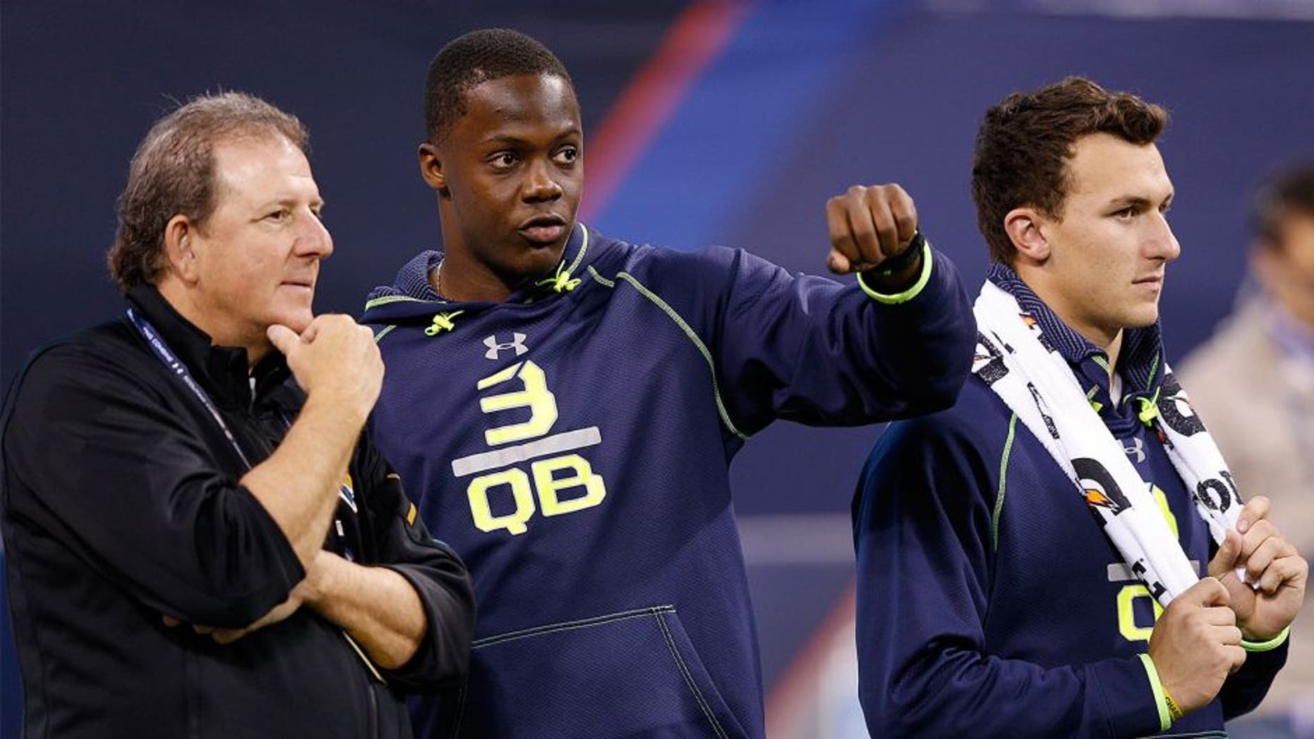 INDIANAPOLIS, IN - FEBRUARY 23: Former Louisville quarterback Teddy Bridgewater (center) and former Texas A&M quarterback Johnny Manziel stand alongside Jacksonville Jaguars assistant Frank Scelfo during the 2014 NFL Combine at Lucas Oil Stadium on February 23, 2014 in Indianapolis, Indiana. (Photo by Joe Robbins/Getty Images)