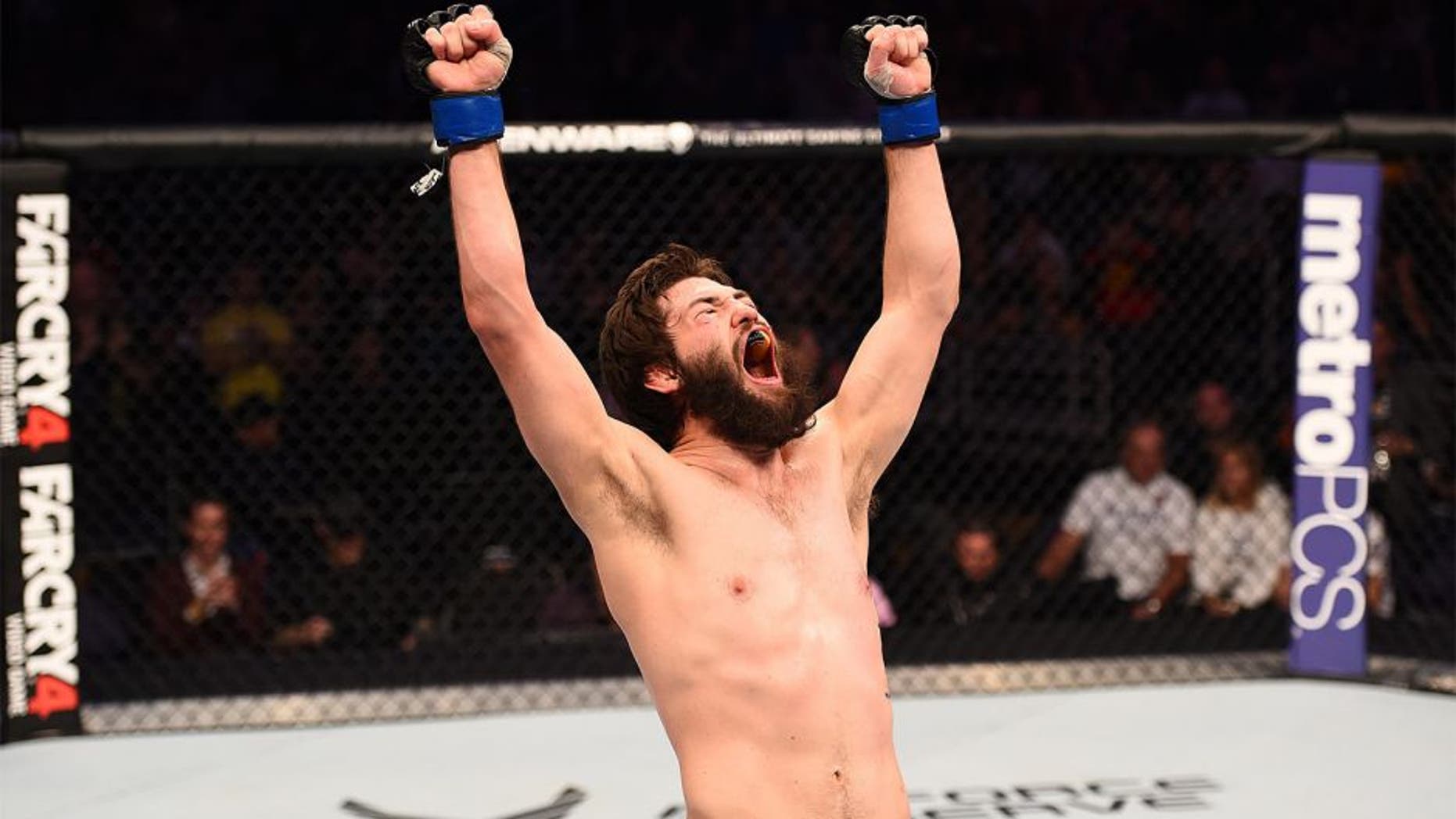 PHOENIX, AZ - DECEMBER 13: Bryan Barberena celebrates after defeating Joe Ellenberger in their lightweight fight during the UFC Fight Night event at the U.S. Airways Center on December 13, 2014 in Phoenix, Arizona. (Photo by Josh Hedges/Zuffa LLC/Zuffa LLC via Getty Images)