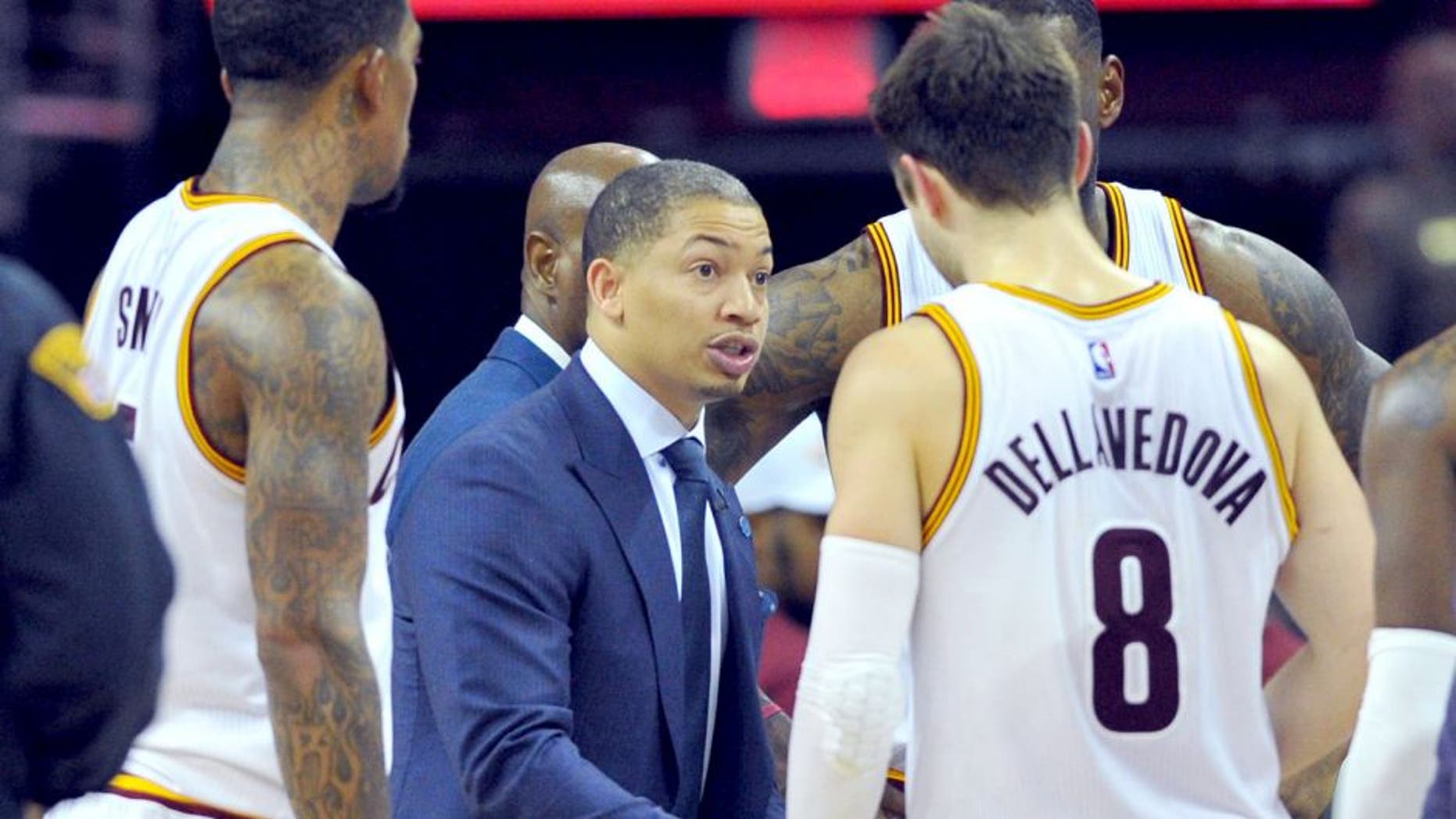 Jan 23, 2016; Cleveland, OH, USA; Cleveland Cavaliers head coach Tyronn Lue (C) huddles with his team during the fourth quarter against the Chicago Bulls at Quicken Loans Arena. The Bulls won 96-83. Mandatory Credit: Ken Blaze-USA TODAY Sports