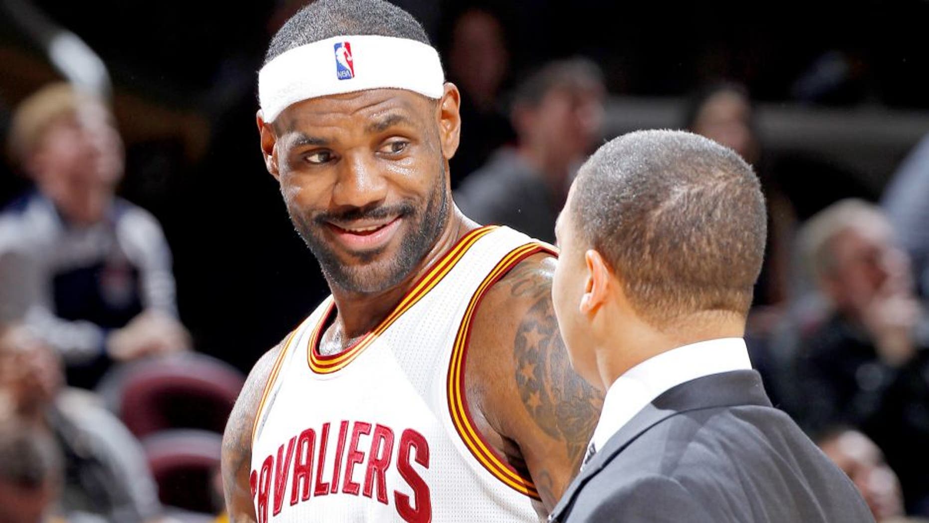 CLEVELAND, OH - NOVEMBER 23: LeBron James #23 and assistant coach Tyronn Lue of the Cleveland Cavaliers talk during the game against the Orlando Magic on November 23, 2015 at Quicken Loans Arena in Cleveland, Ohio. NOTE TO USER: User expressly acknowledges and agrees that, by downloading and or using this Photograph, user is consenting to the terms and condition of the Getty Images License Agreement. (Photo by Rocky Widner/Getty Images)