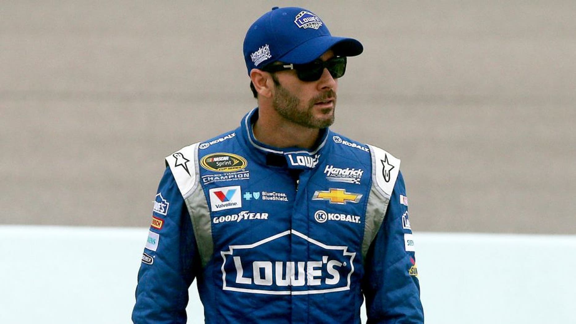 HOMESTEAD, FL - NOVEMBER 21: Jimmie Johnson, driver of the #48 Lowe's Chevrolet, walks on pit road during practice for the NASCAR Sprint Cup Series Ford EcoBoost 400 at Homestead-Miami Speedway on November 21, 2015 in Homestead, Florida. (Photo by Sean Gardner/Getty Images)