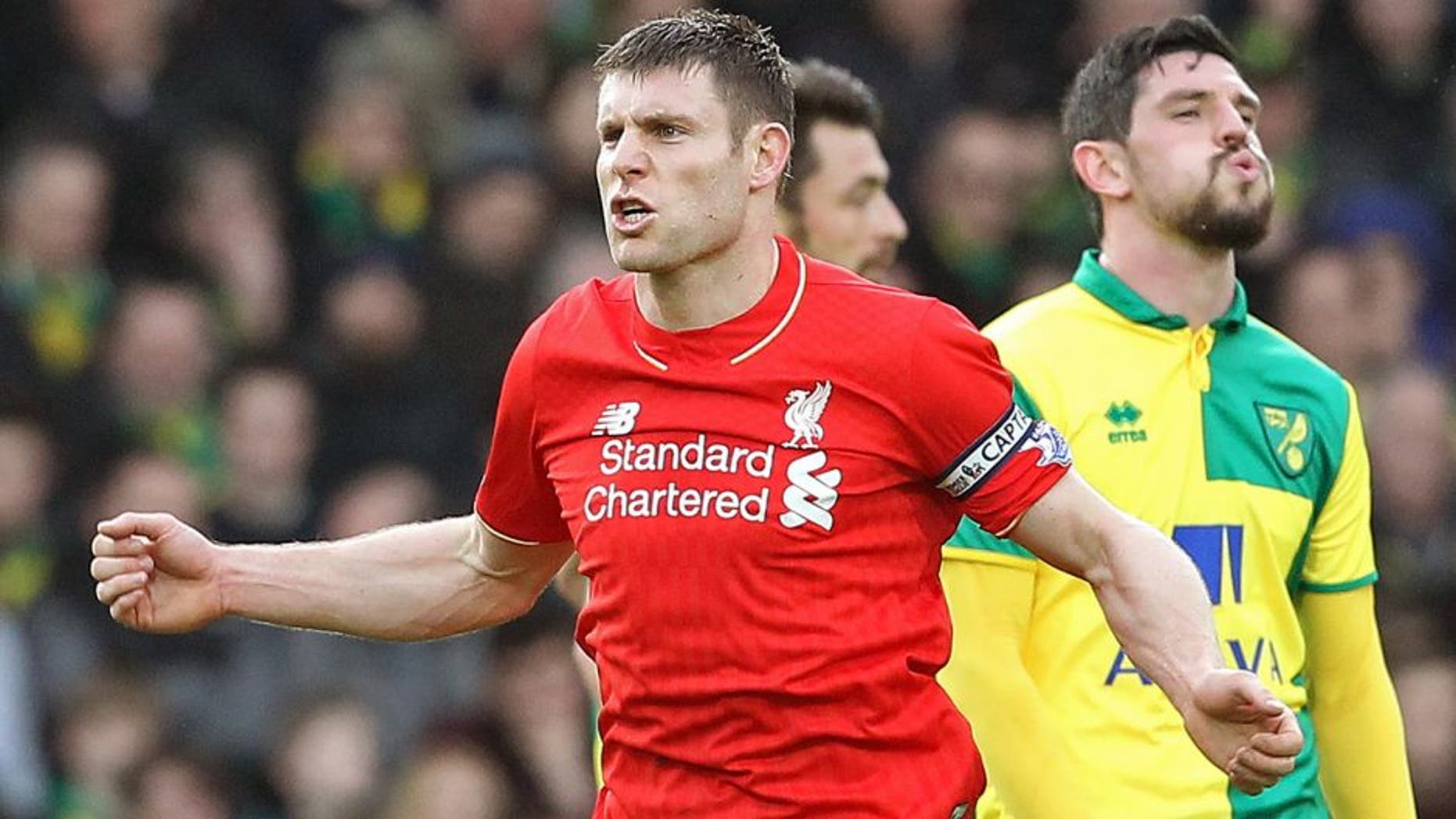 LiverpoolÃÂs captain English midfielder James Milner celebrates scoring their fourth goal during the English Premier League football match between Norwich City and Liverpool at Carrow Road in Norwich, eastern England, on January 23, 2016. AFP PHOTO / LINDSEY PARNABY RESTRICTED TO EDITORIAL USE. No use with unauthorized audio, video, data, fixture lists, club/league logos or 'live' services. Online in-match use limited to 75 images, no video emulation. No use in betting, games or single club/league/player publications. / AFP / LINDSEY PARNABY (Photo credit should read LINDSEY PARNABY/AFP/Getty Images)