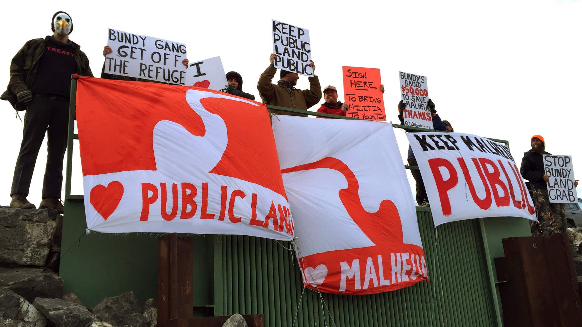 Demonstrators gather near a national wildlife refuge to protest against a group occupying the land Saturday, Jan. 23, 2016, near in Burns, Ore.