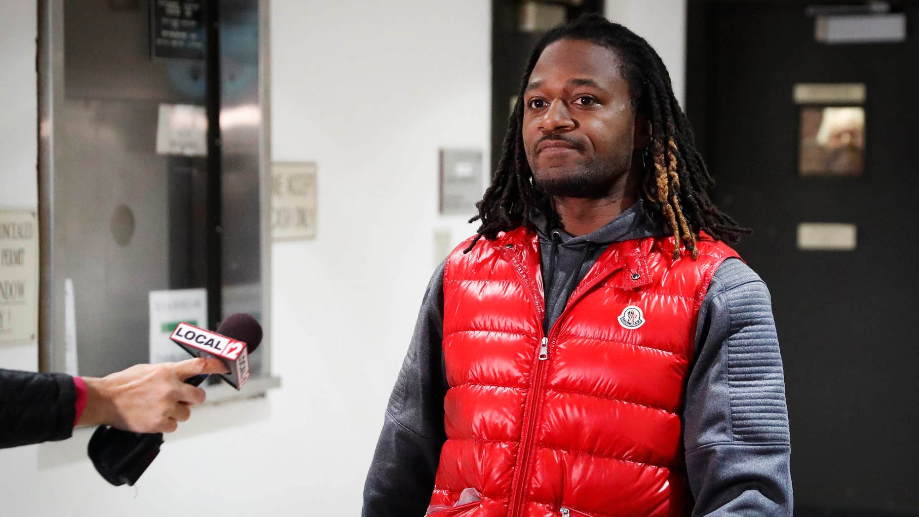 Bengals cornerback Adam "Pacman" Jones prepares to speak with reporters as he is released from the Hamilton County Justice Center after be charged with felony harassment with a bodily substance, Wednesday, Jan. 4, 2017, in Cincinnati.