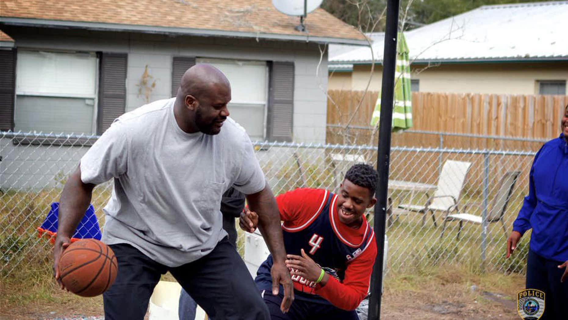 Shaquille O'Neal surprises Florida teens and officer with game of pickup basketball.