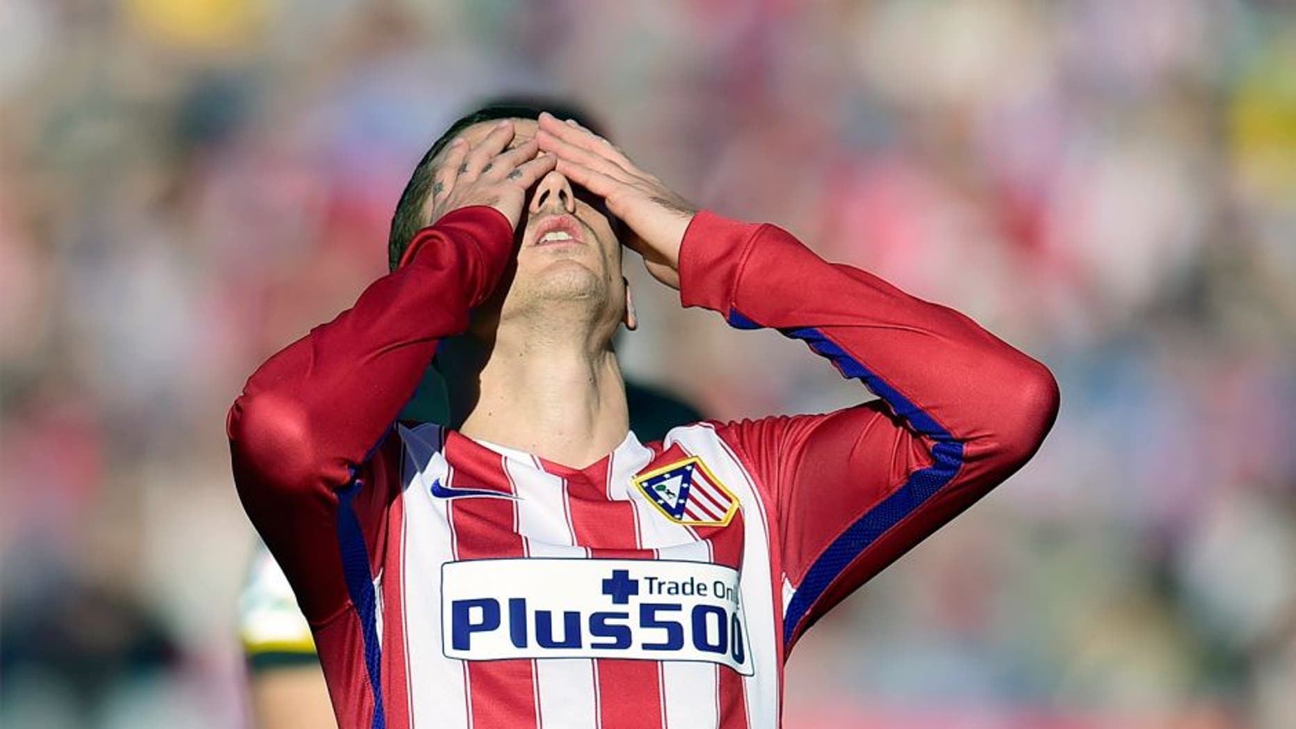Atletico Madrid's French forward Antoine Griezmann reacts after missing a goal during the Spanish league football match Club Atletico de Madrid vs Sevilla FC at the Vicente Calderon stadium in Madrid on January 24, 2016. AFP PHOTO / JAVIER SORIANO / AFP / JAVIER SORIANO (Photo credit should read JAVIER SORIANO/AFP/Getty Images)
