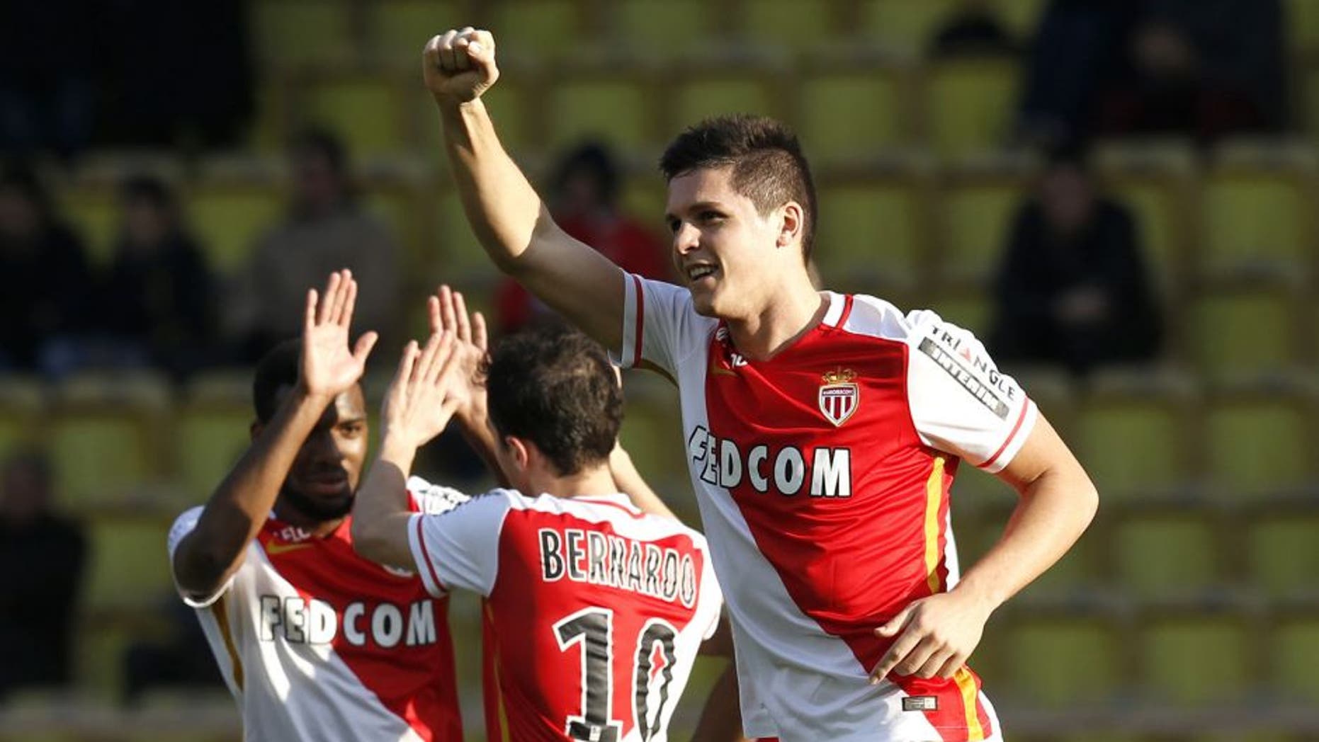 Monaco's Argentinian forward Guido Carrillo (R) celebrates after scoring a goal during the French L1 football match Monaco (ASM) vs Toulouse (TFC) on January 24, 2016 at the Louis II Stadium in Monaco. AFP PHOTO / VALERY HACHE / AFP / VALERY HACHE (Photo credit should read VALERY HACHE/AFP/Getty Images)