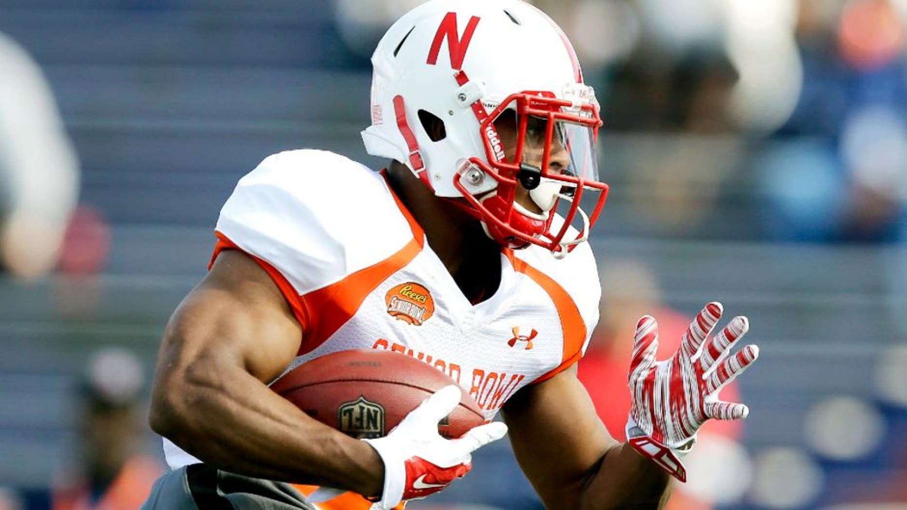 Nebraska running back Ameer Abdullah runs the ball during NCAA college football practice for the Senior Bowl, Tuesday, Jan. 20, 2015, at Ladd-Peebles Stadium in Mobile, Ala. (AP Photo/Brynn Anderson)