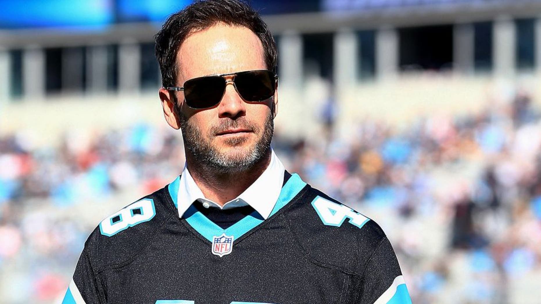 CHARLOTTE, NC - DECEMBER 14: Nascar driver Jimmie Johnson helped pound the drum for the Carolina Panthers before their game against the Tampa Bay Buccaneers at Bank of America Stadium on December 14, 2014 in Charlotte, North Carolina. (Photo by Streeter Lecka/Getty Images)