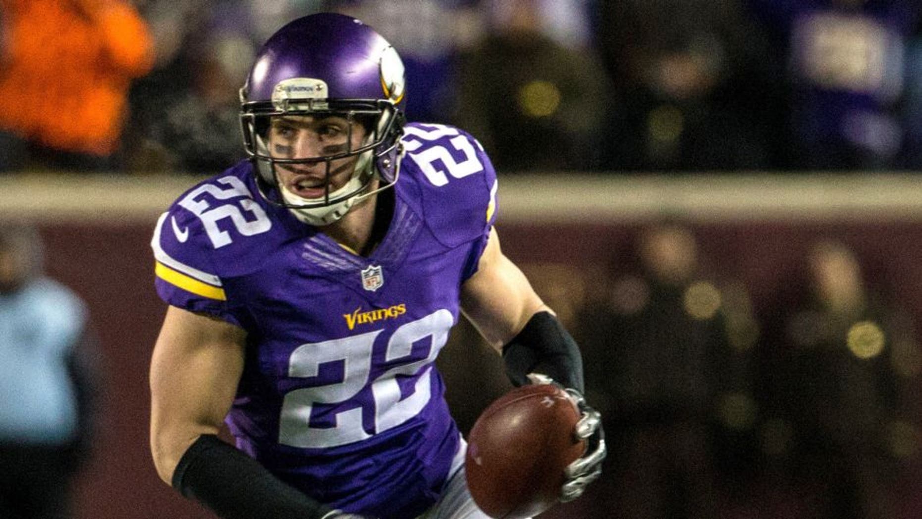 Dec 27, 2015; Minneapolis, MN, USA; Minnesota Vikings safety Harrison Smith (22) returns an interception for a touchdown during the second quarter against the New York Giants at TCF Bank Stadium. Mandatory Credit: Brace Hemmelgarn-USA TODAY Sports
