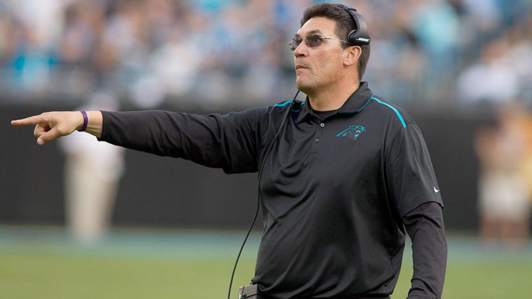 Dec 13, 2015; Charlotte, NC, USA; Carolina Panthers head coach Ron Rivera challenges the play during the third quarter against the Atlanta Falcons at Bank of America Stadium. Panthers defeated the Falcons 38-0. Mandatory Credit: Jeremy Brevard-USA TODAY Sports