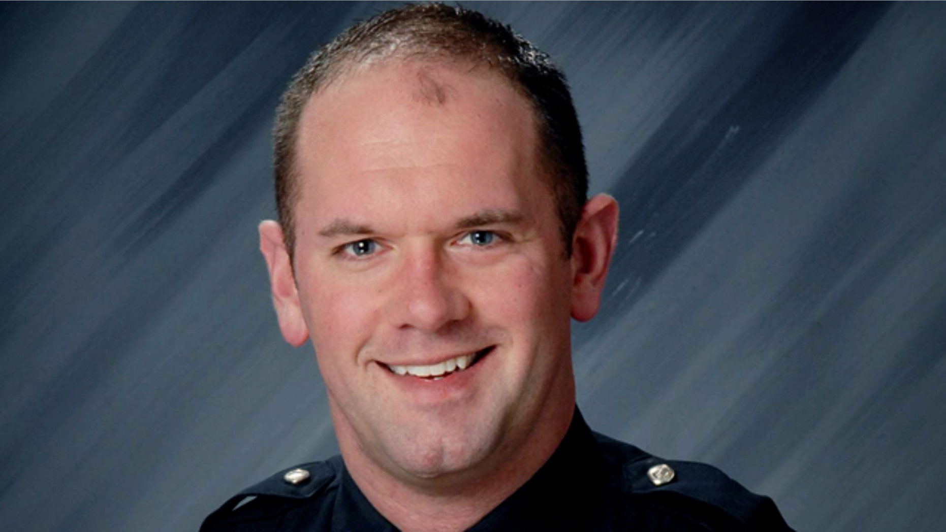 This file photo provided by the Indianapolis Metropolitan Police Department shows Officer David Moore.